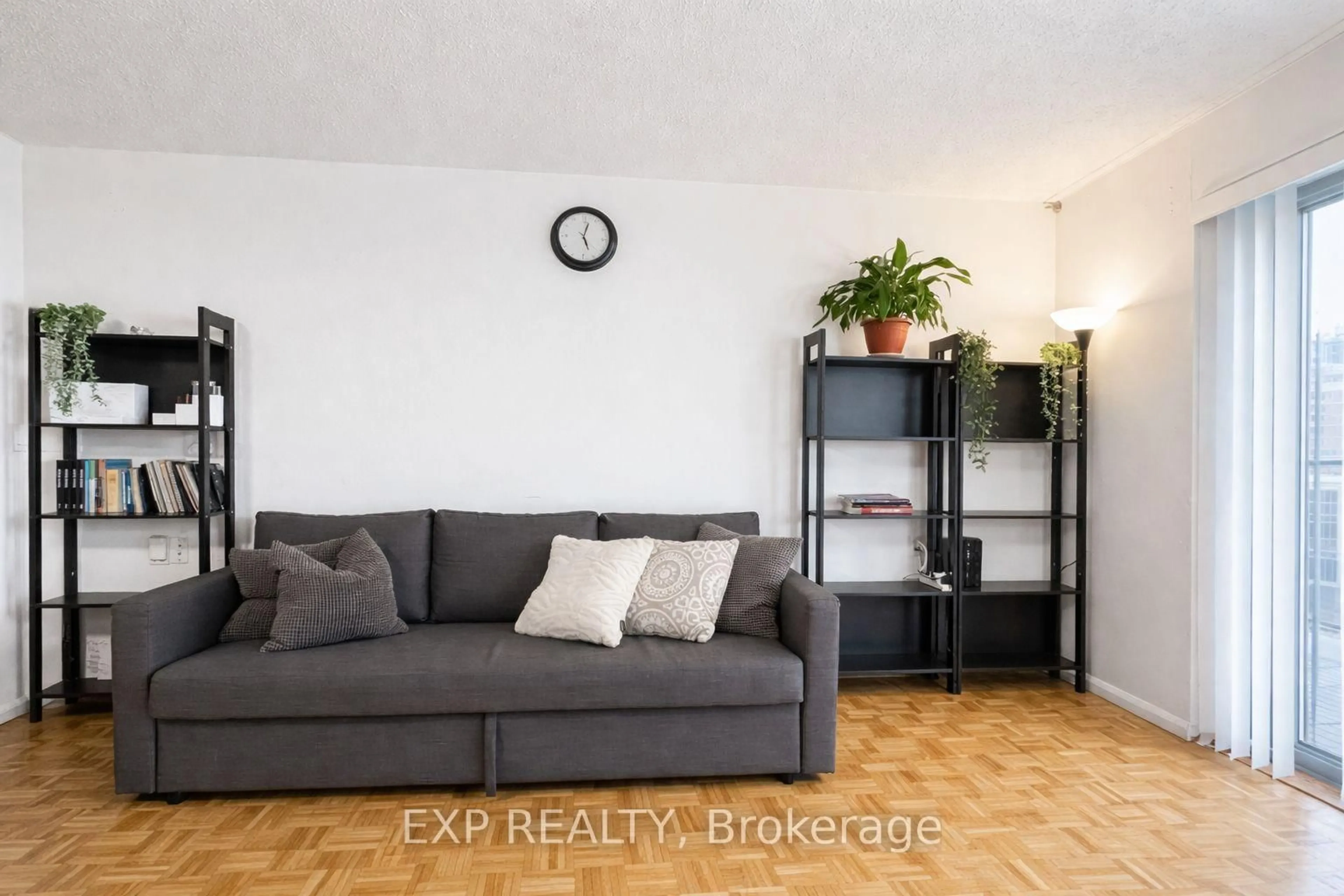 Living room with furniture, wood/laminate floor for 475 Laurier Ave #705, Ottawa Ontario K1R 7X1