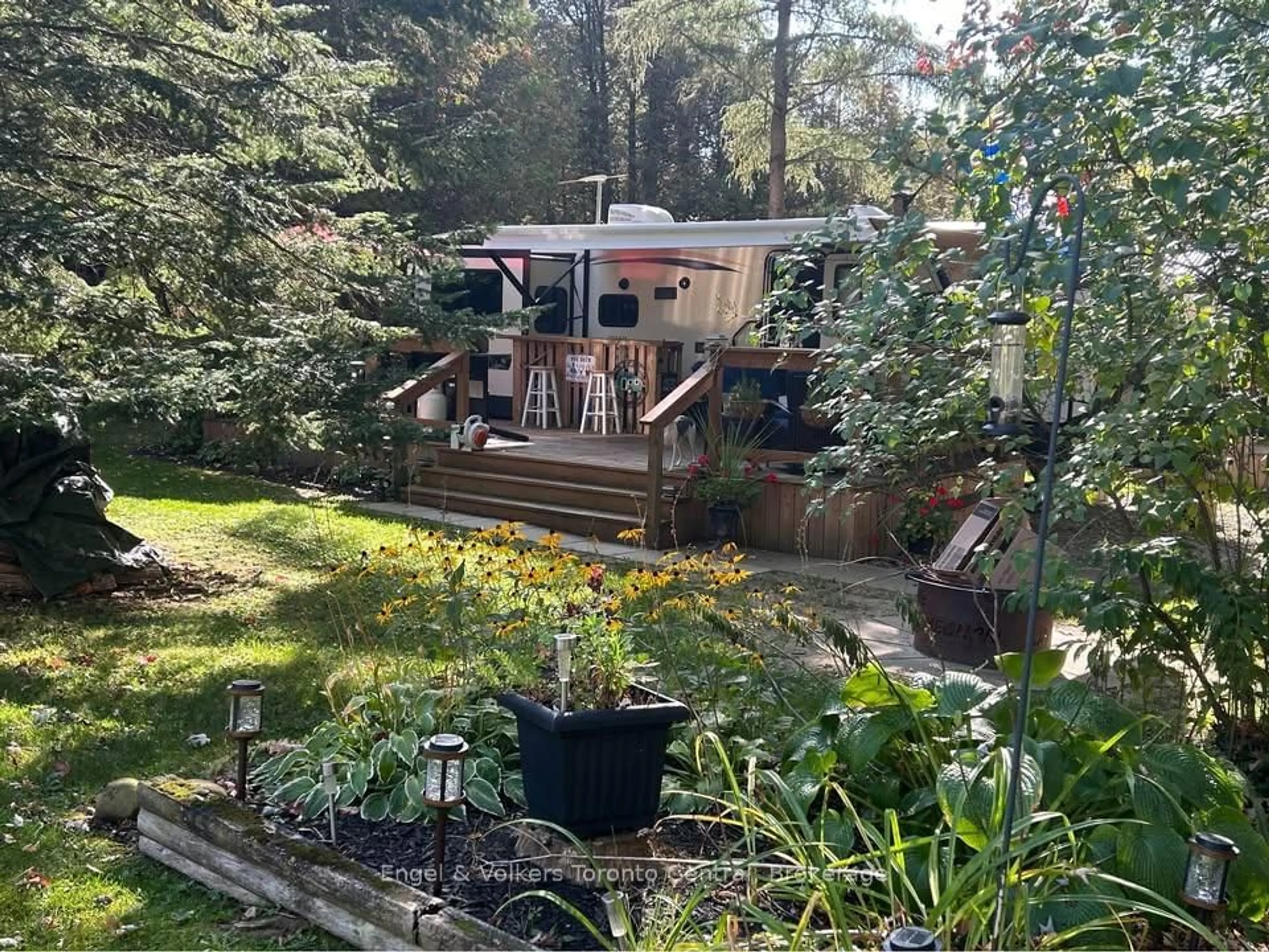 A pic from outside/outdoor area/front of a property/back of a property/a pic from drone, forest/trees view for 7489 SIDERAOD 5 E #H 21, Wellington North Ontario N0G 2L0