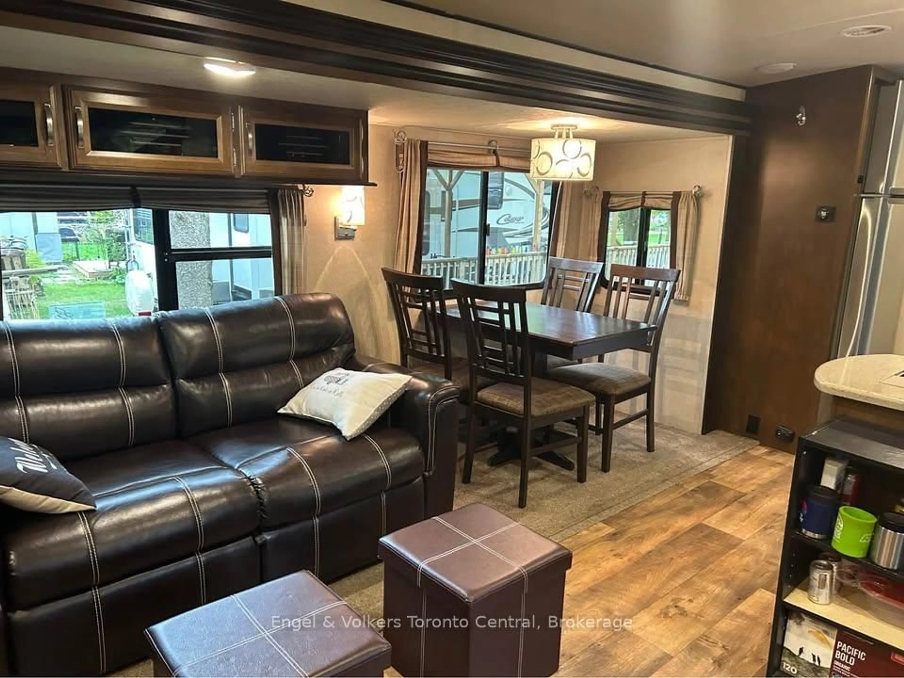 Living room with furniture, wood/laminate floor for 7489 SIDERAOD 5 E #H 21, Wellington North Ontario N0G 2L0