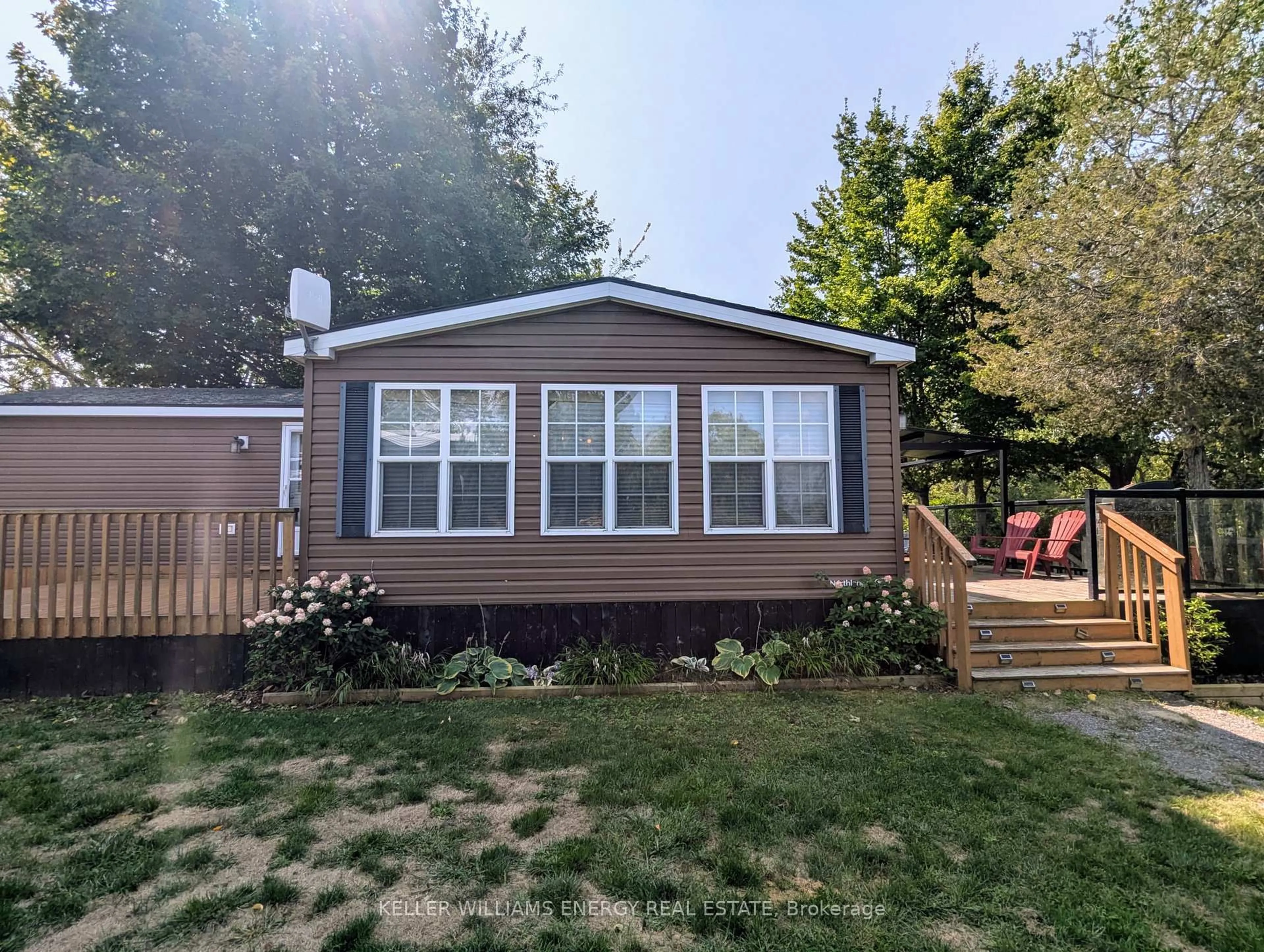 Home with vinyl exterior material, street for 486 County Road 18 Cherry Beach Lane Rd ##54, Prince Edward County Ontario K0K 1P0