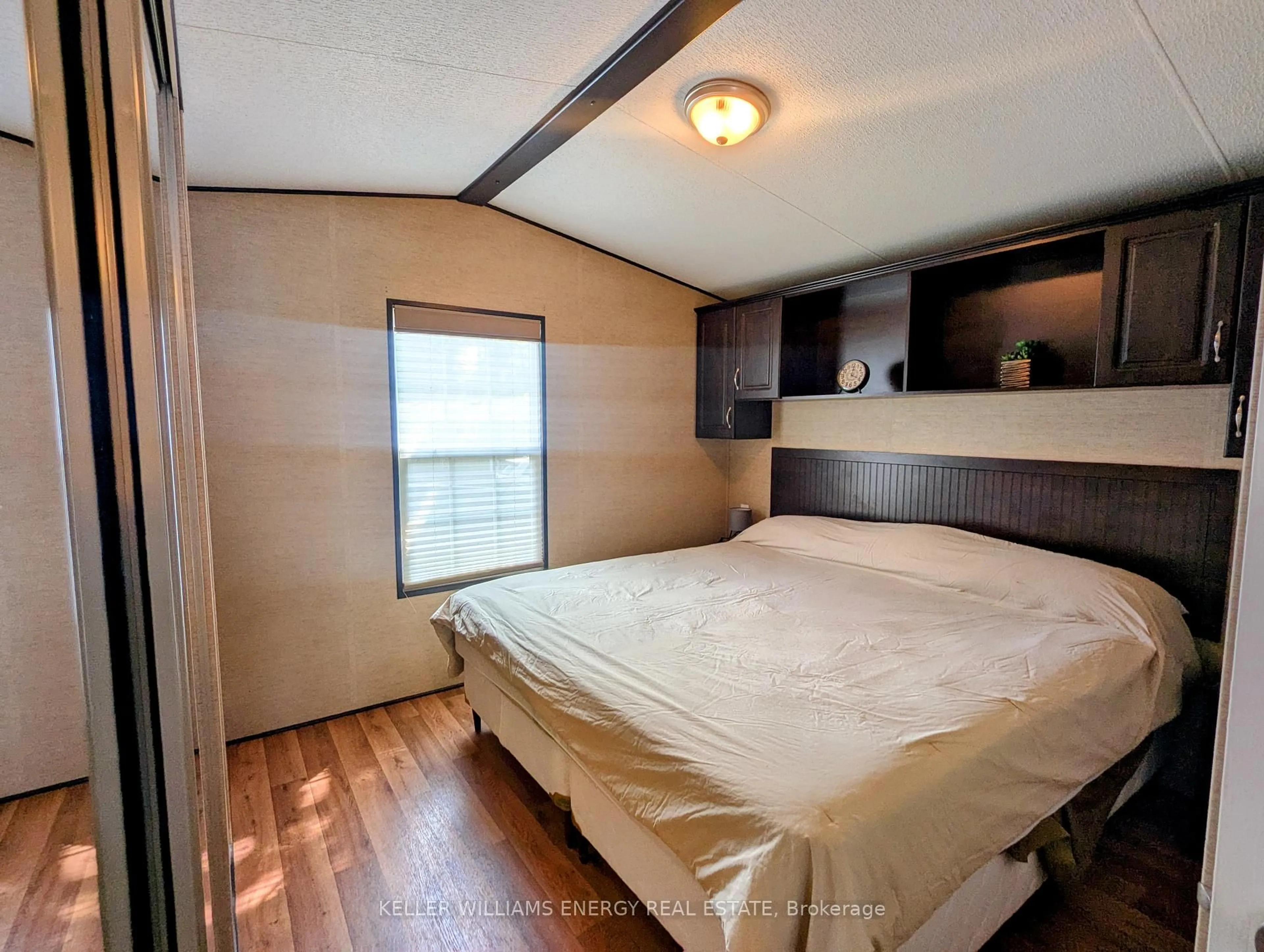 Bedroom with bed, wood/laminate floor for 486 County Road 18 Cherry Beach Lane Rd ##54, Prince Edward County Ontario K0K 1P0