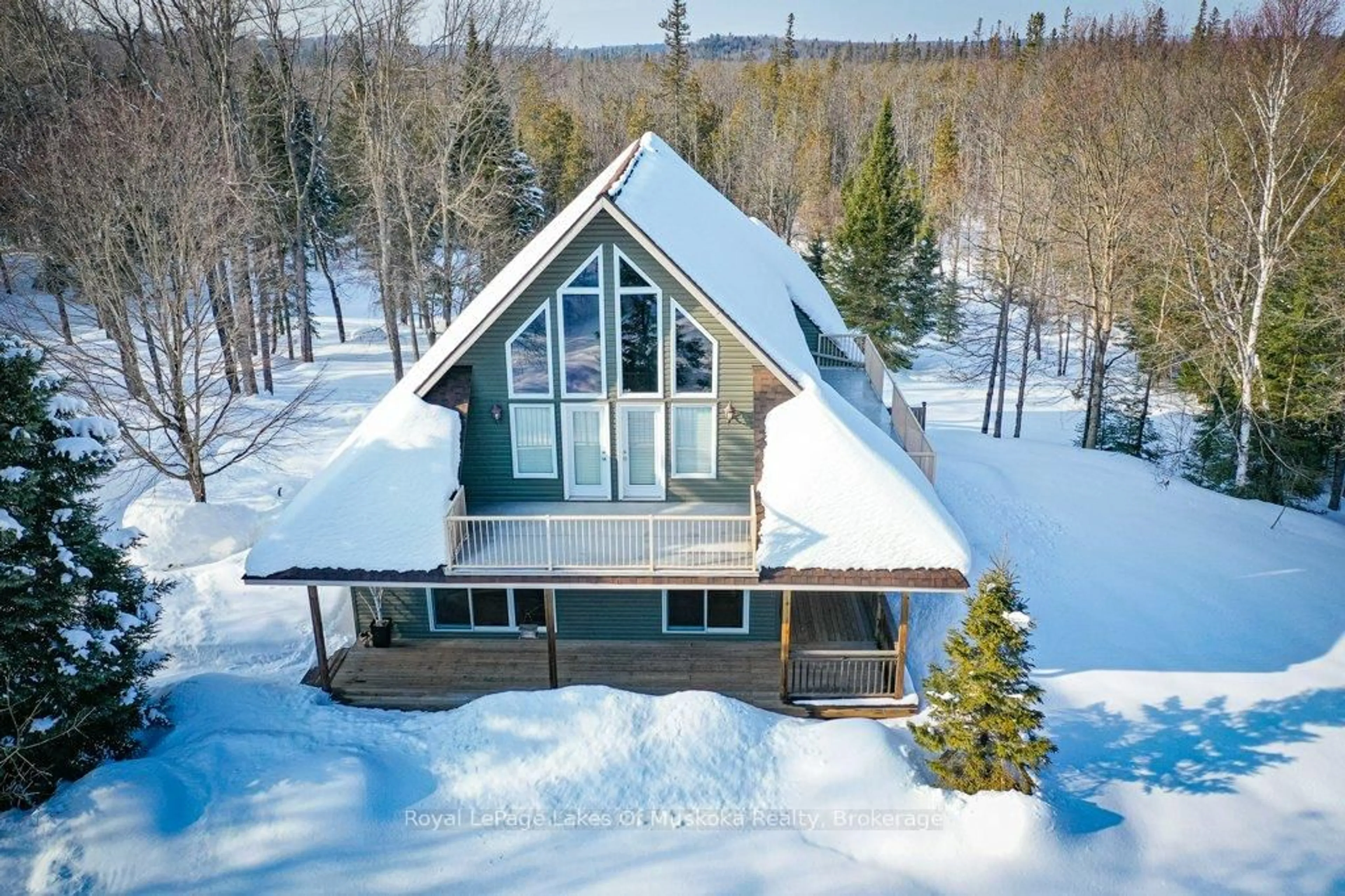 A pic from outside/outdoor area/front of a property/back of a property/a pic from drone, water/lake/river/ocean view for 2411 Hwy. 118 E. Highway, Bracebridge Ontario P1L 1X1