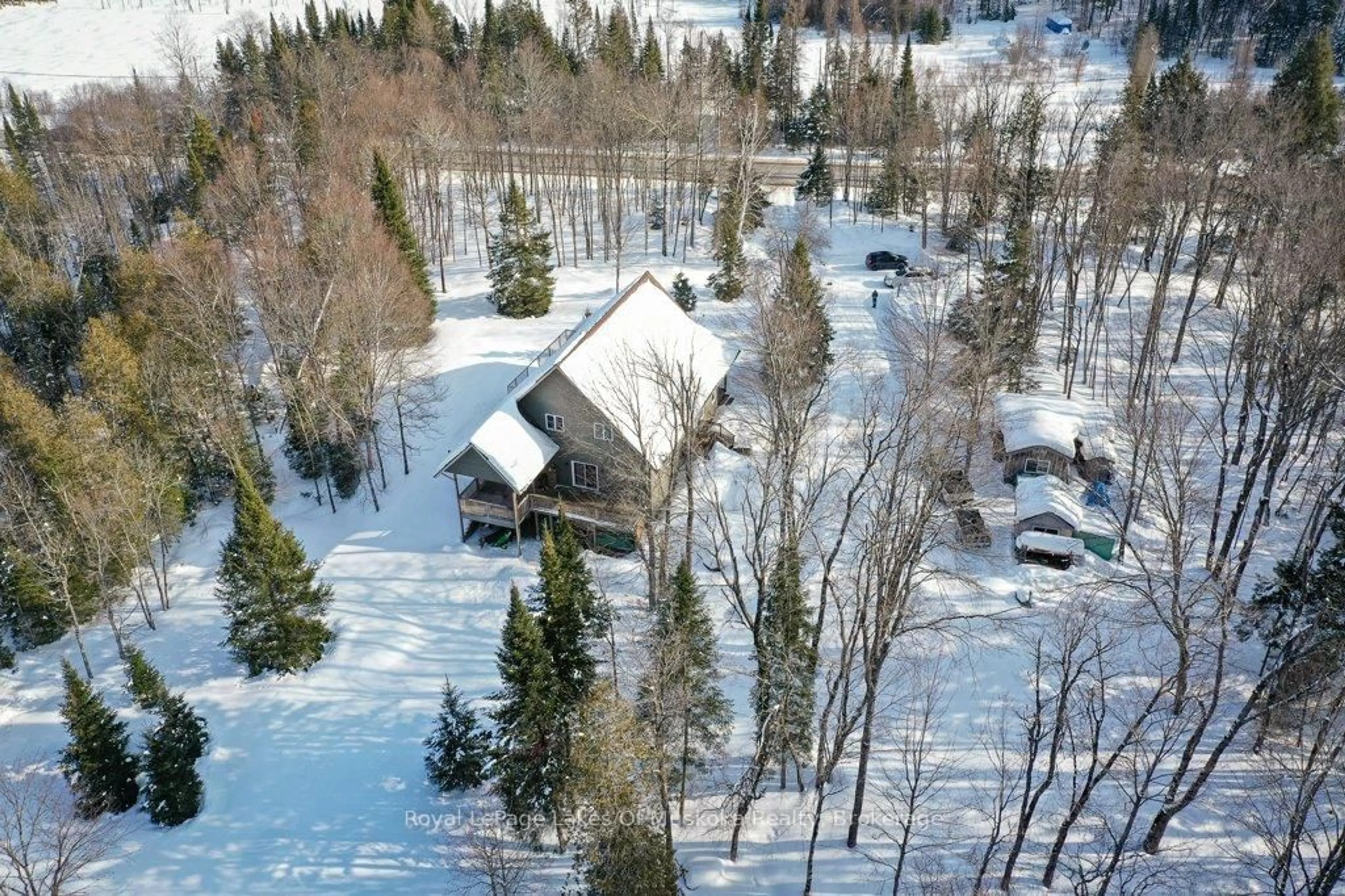 A pic from outside/outdoor area/front of a property/back of a property/a pic from drone, unknown for 2411 Hwy. 118 E. Highway, Bracebridge Ontario P1L 1X1