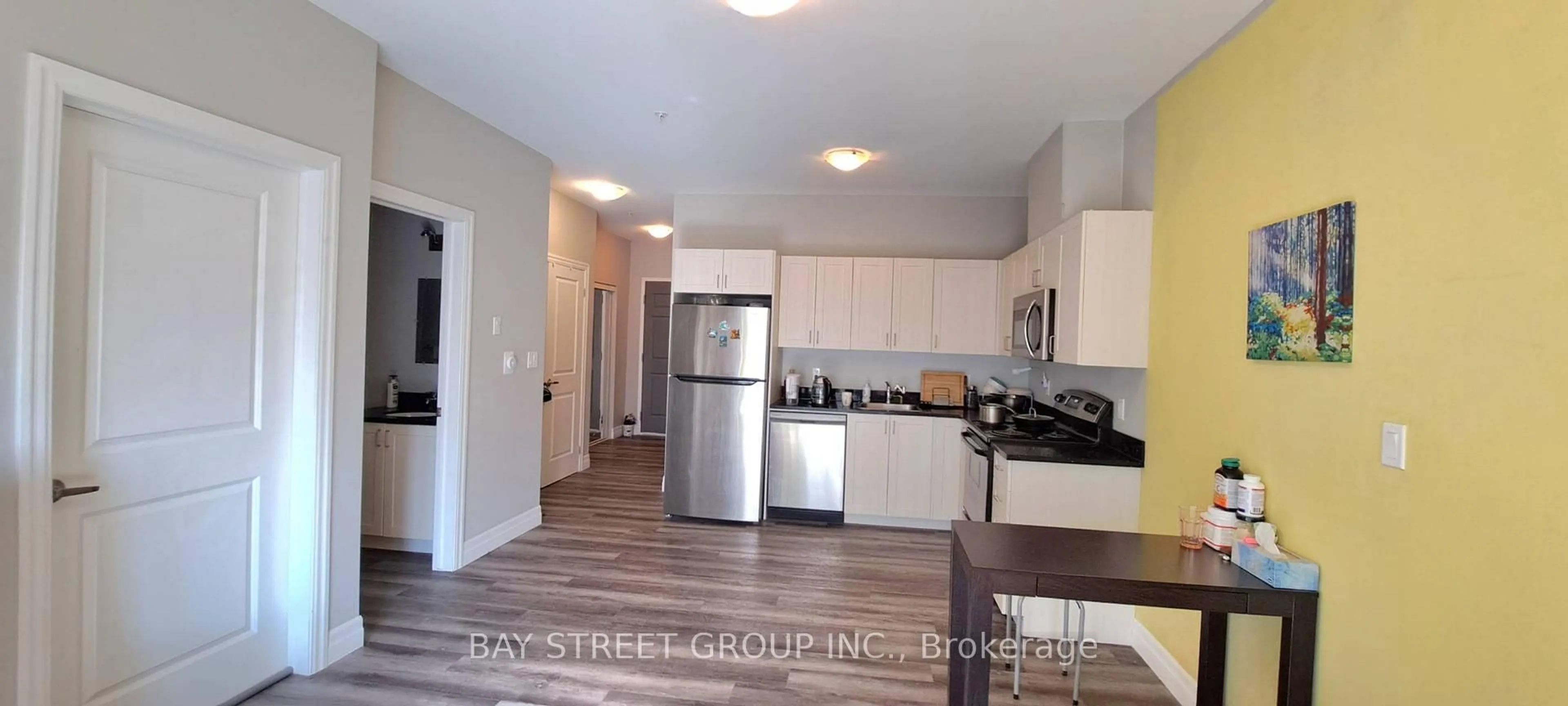 Open concept kitchen, wood/laminate floor for 501 Frontenac St #213, Kingston Ontario K7K 4L9