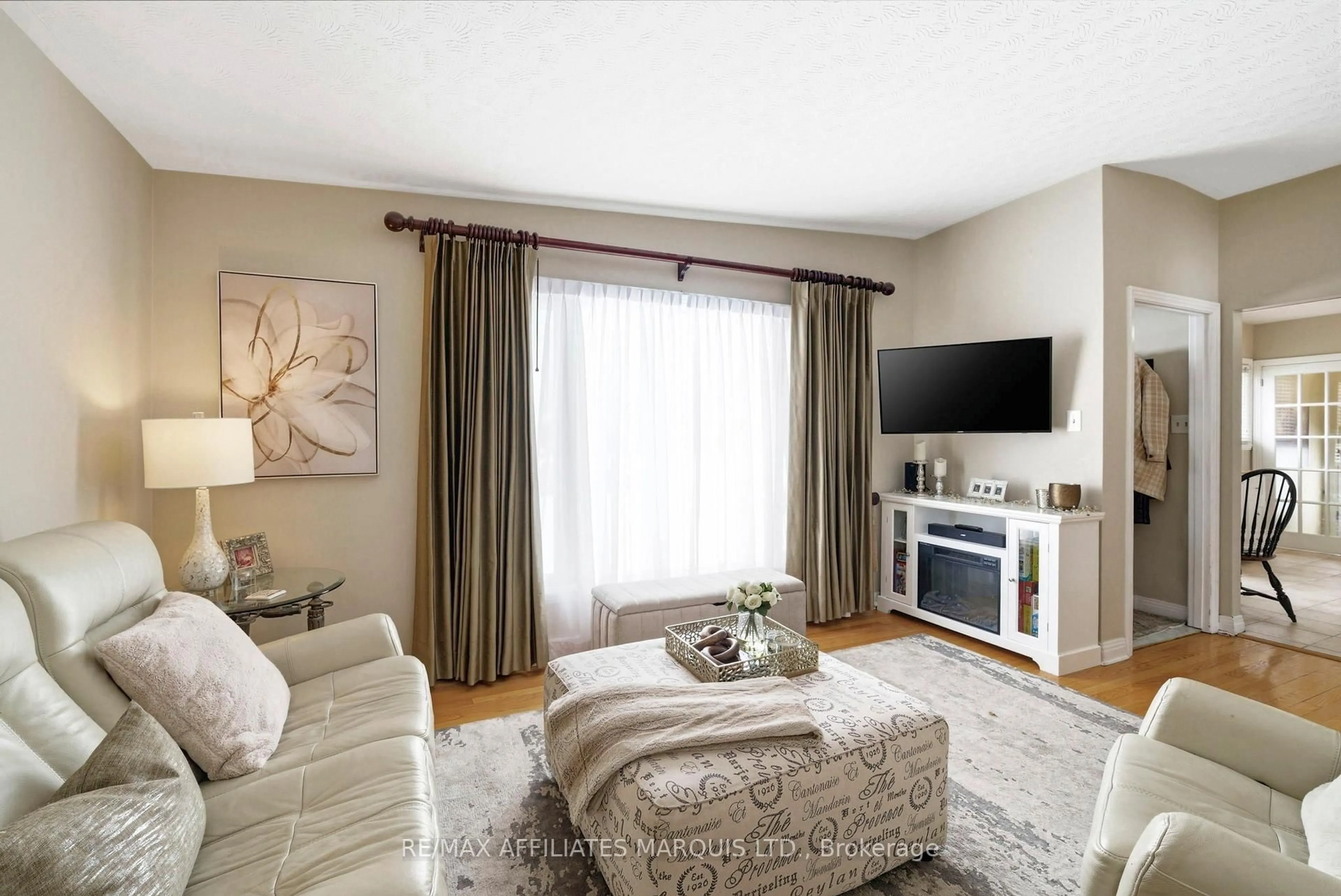 Living room with furniture, wood/laminate floor for 1817 Shearer Ave, Cornwall Ontario K6H 2H4