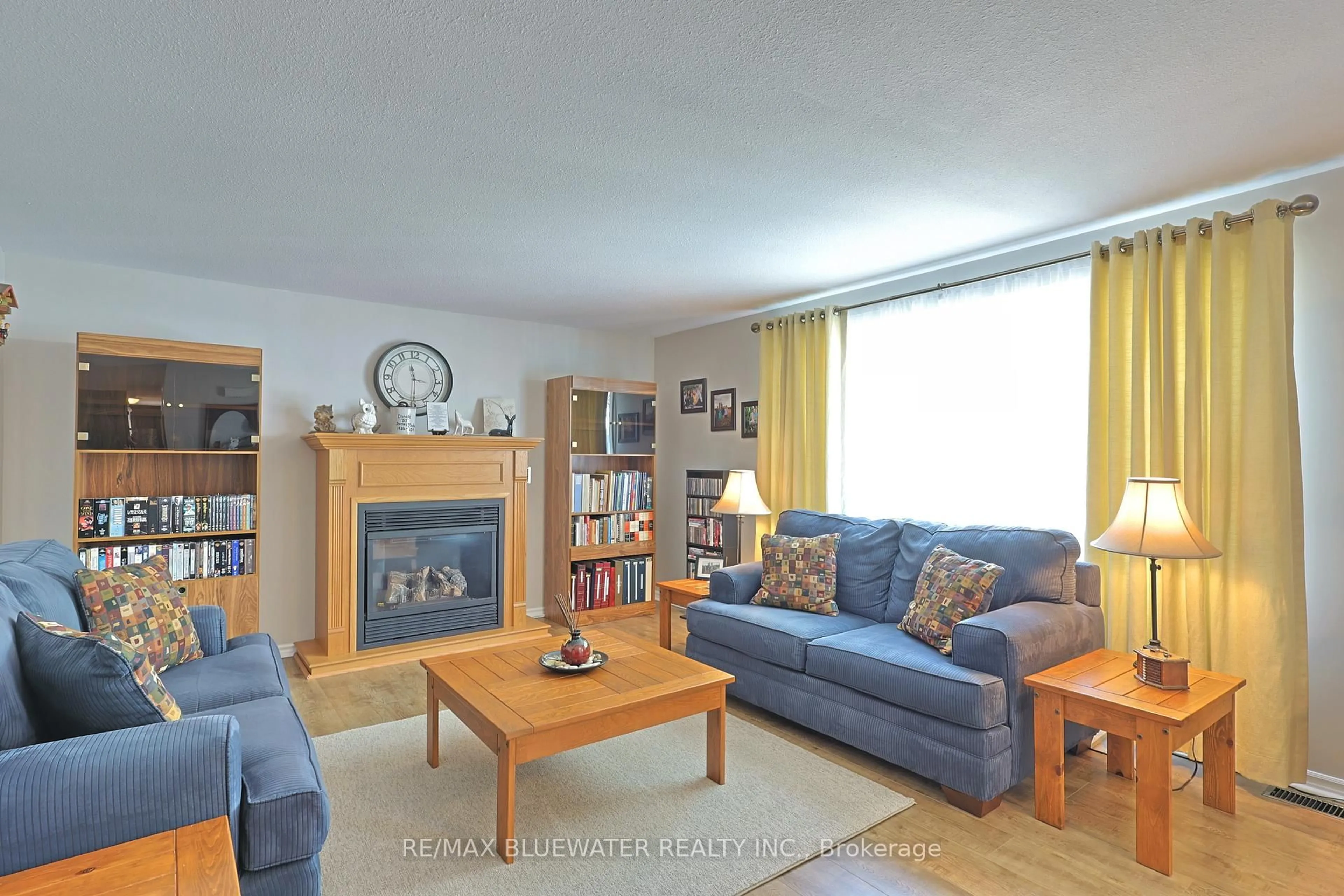 Living room with furniture, wood/laminate floor for 209 Biltmore Dr, South Huron Ontario N0M 1T0