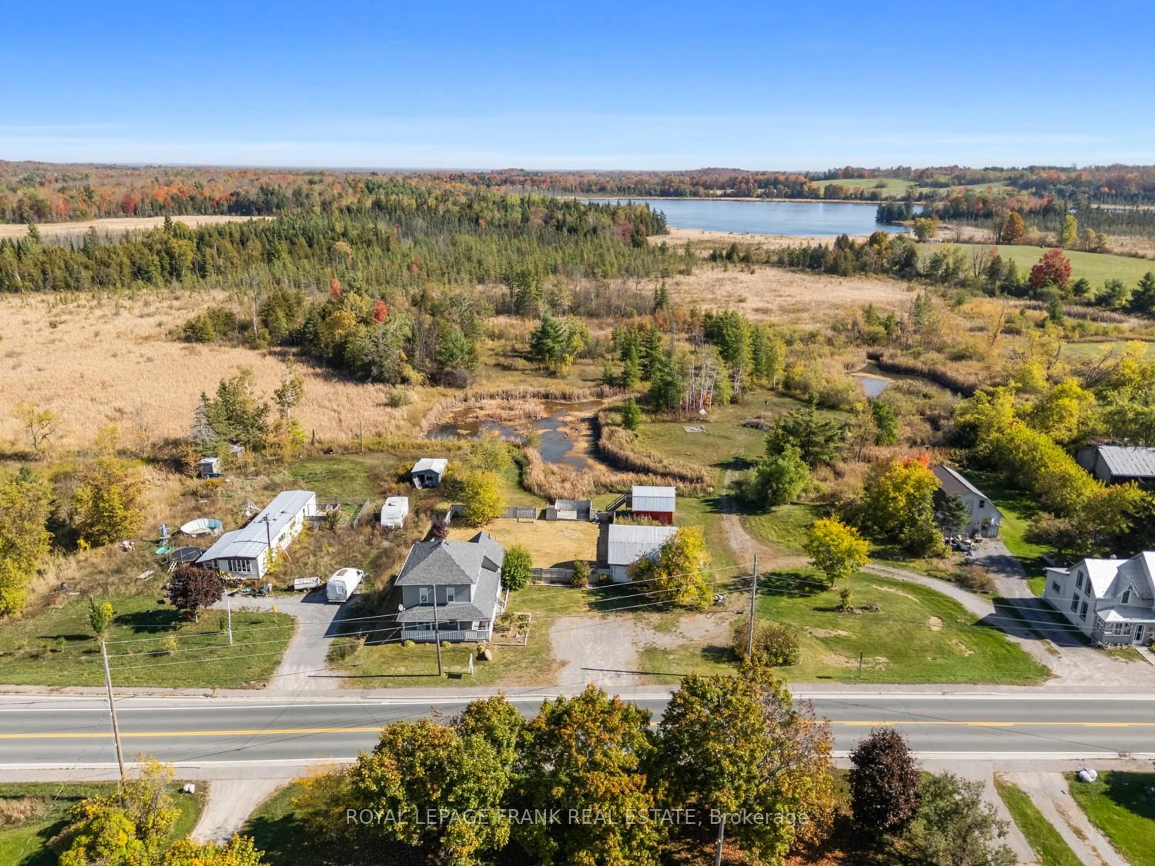 A pic from outside/outdoor area/front of a property/back of a property/a pic from drone, water/lake/river/ocean view for 15880 62 Highway, Madoc Ontario K0K 1Y0