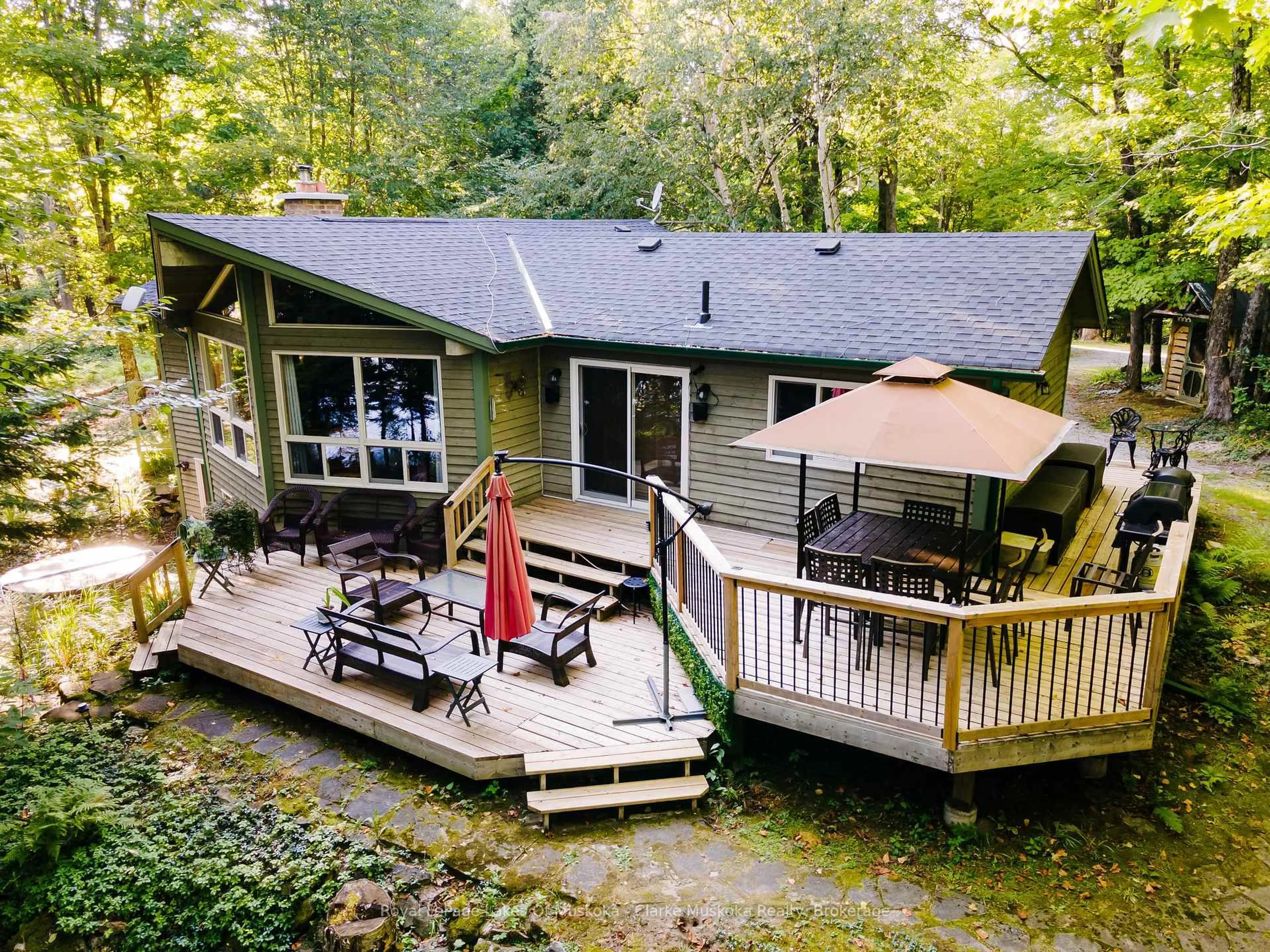 A pic from outside/outdoor area/front of a property/back of a property/a pic from drone, water/lake/river/ocean view for 1157 Between Lakes Tr, Minden Hills Ontario K0M 1J1