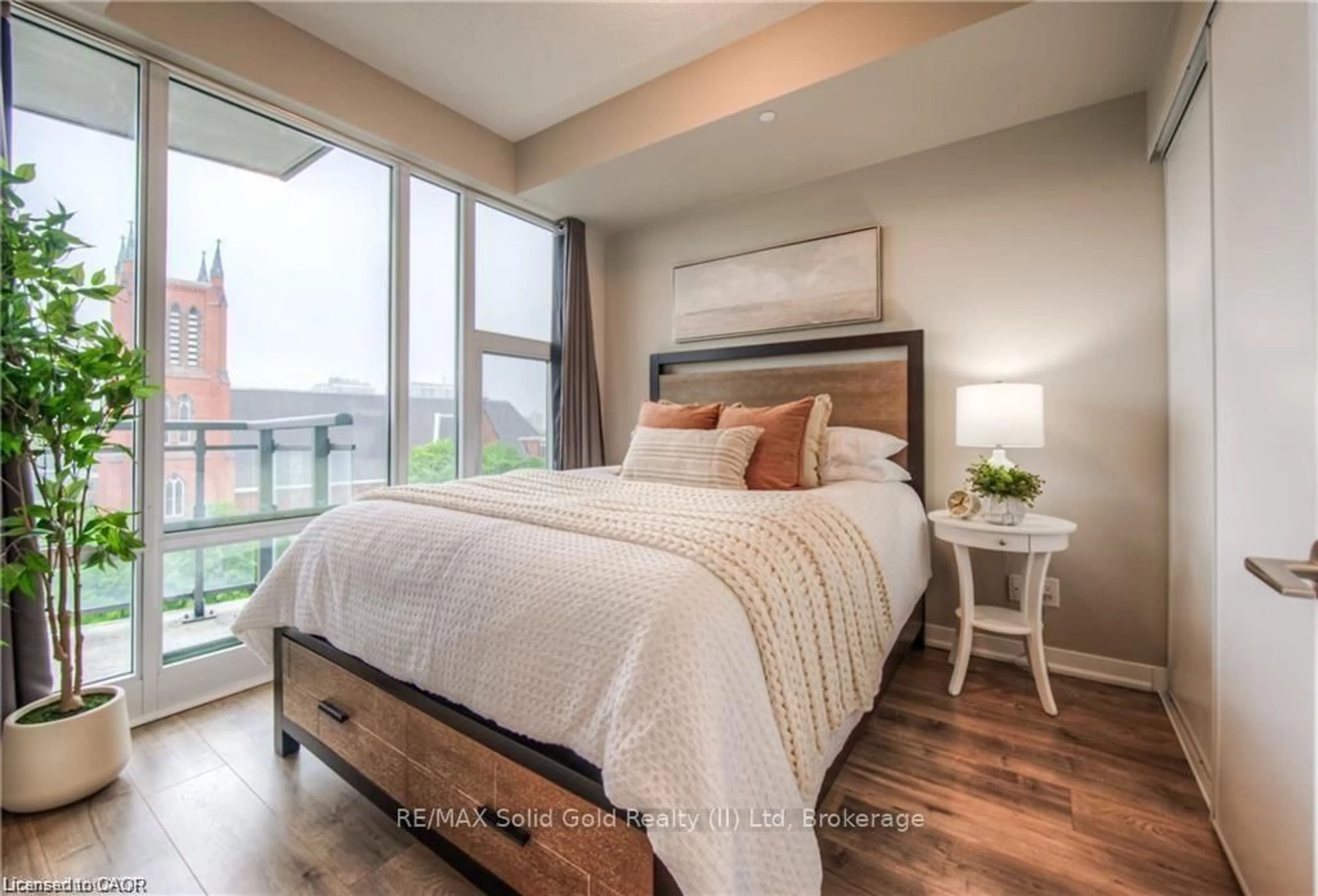 Bedroom with bed, wood/laminate floor for 85 Duke St #703, Kitchener Ontario N2H 4Y7