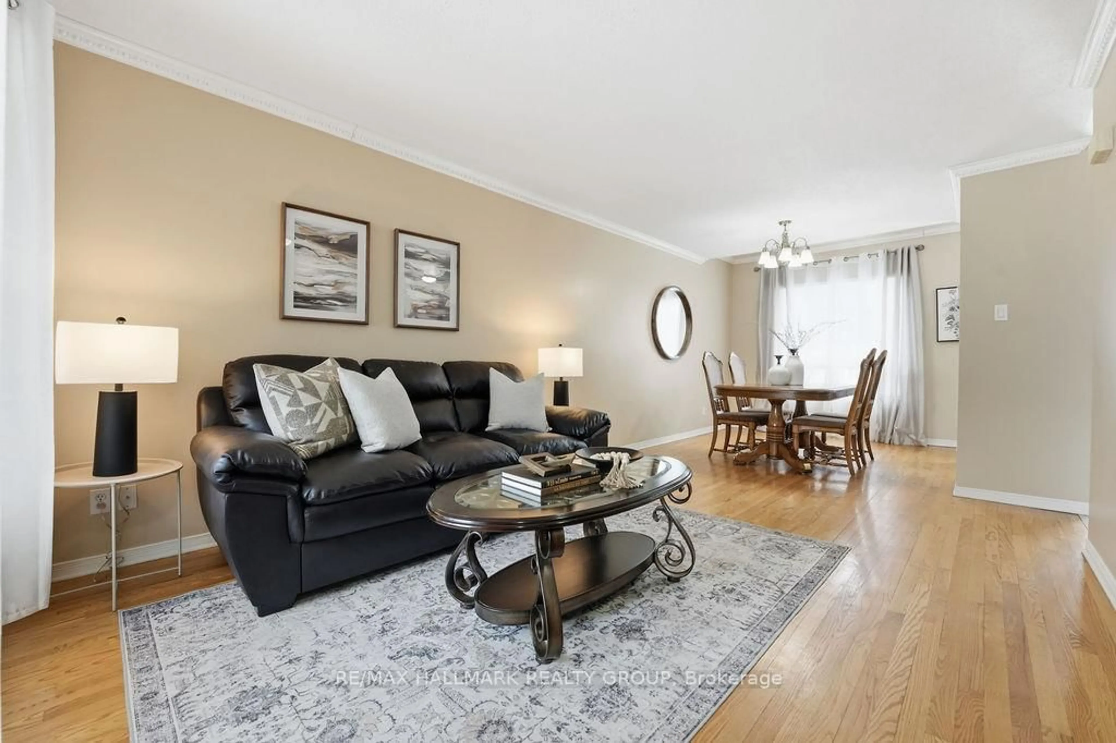 Living room with furniture, wood/laminate floor for 1165 Falconcrest Crt, Orleans Ontario K4A 3Z4