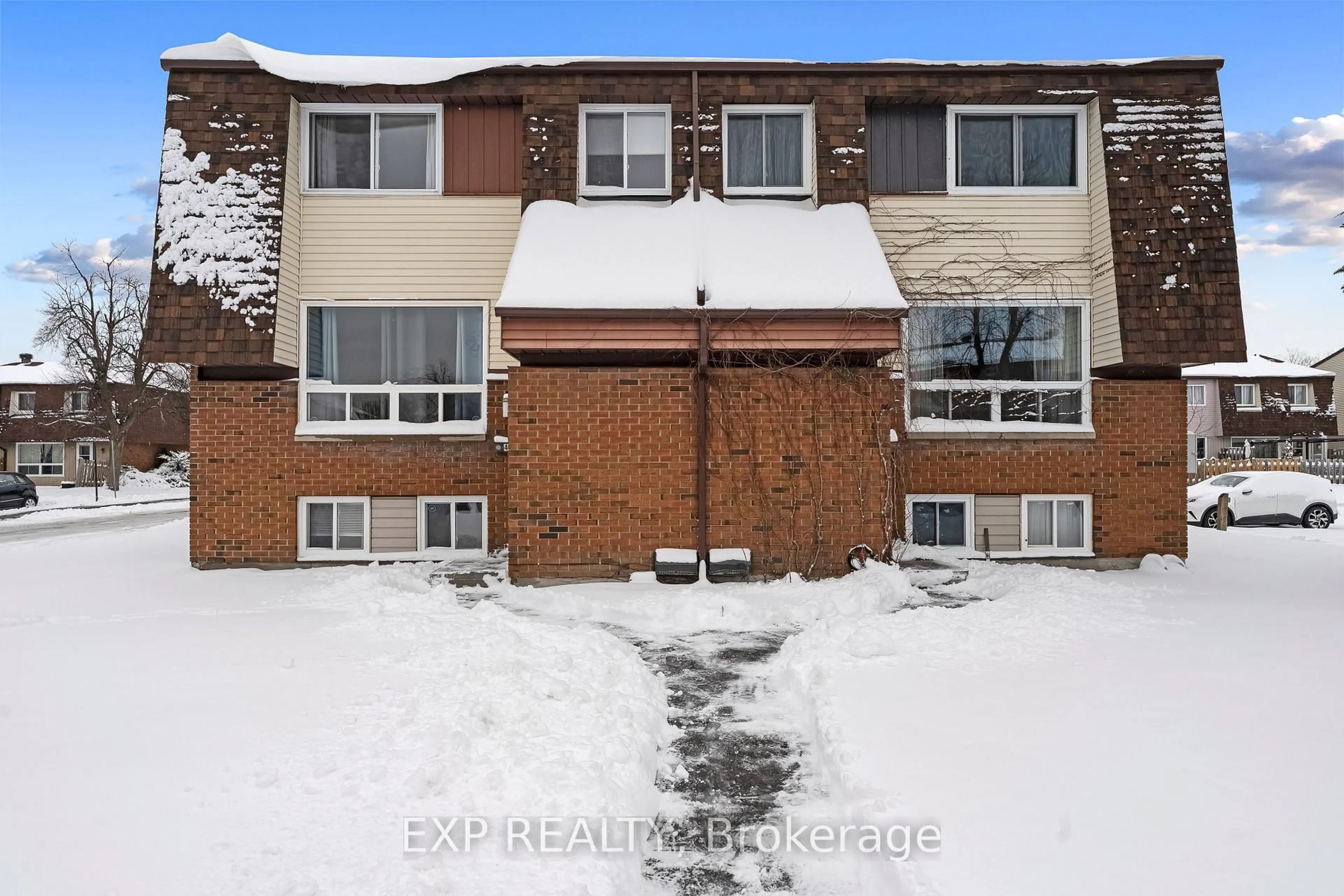 A pic from outside/outdoor area/front of a property/back of a property/a pic from drone, unknown for 44A Woodvale Green #52, Ottawa Ontario K2G 4H4