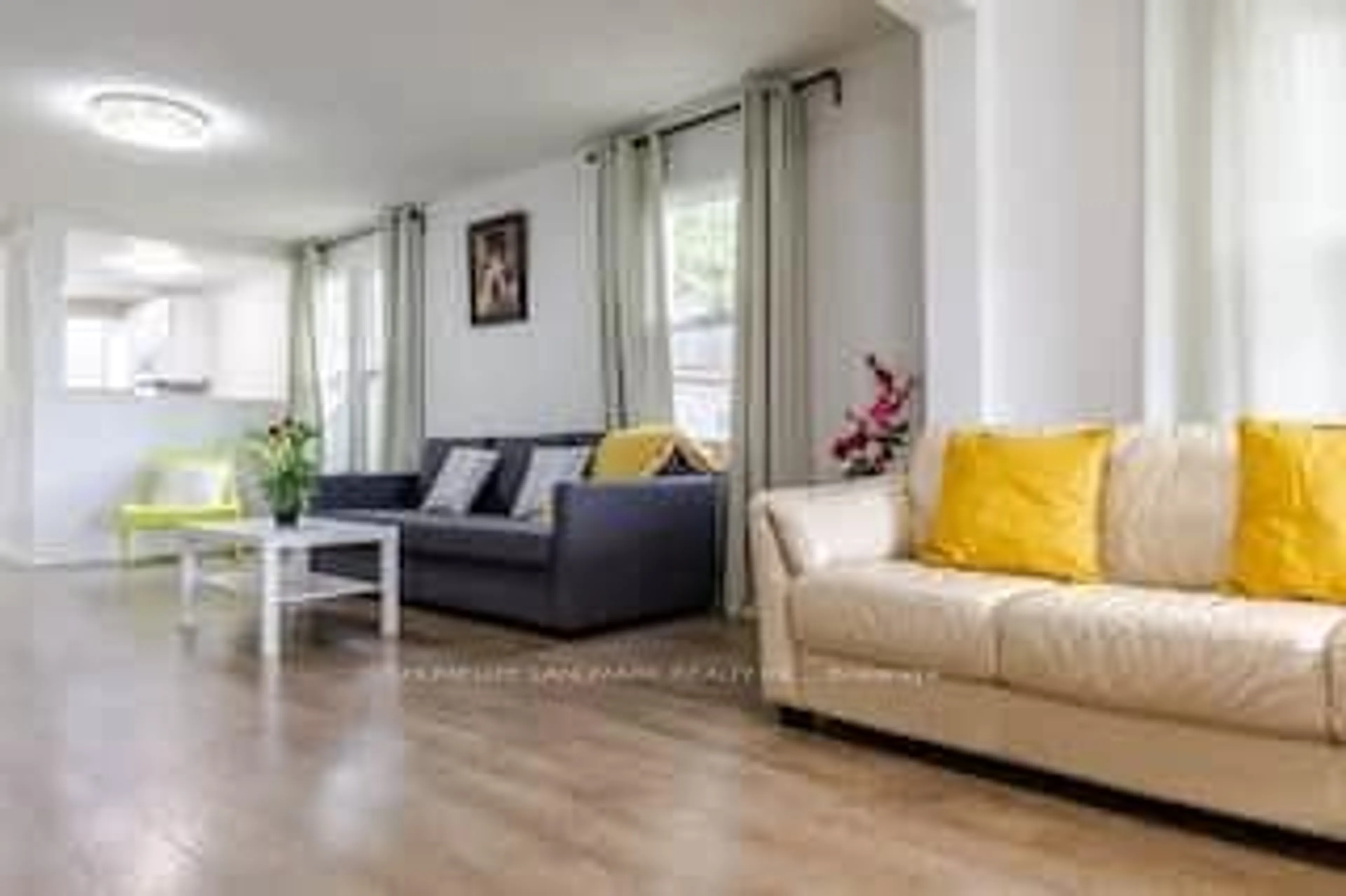 Living room with furniture, wood/laminate floor for 5802 North St, Niagara Falls Ontario L2G 1J6