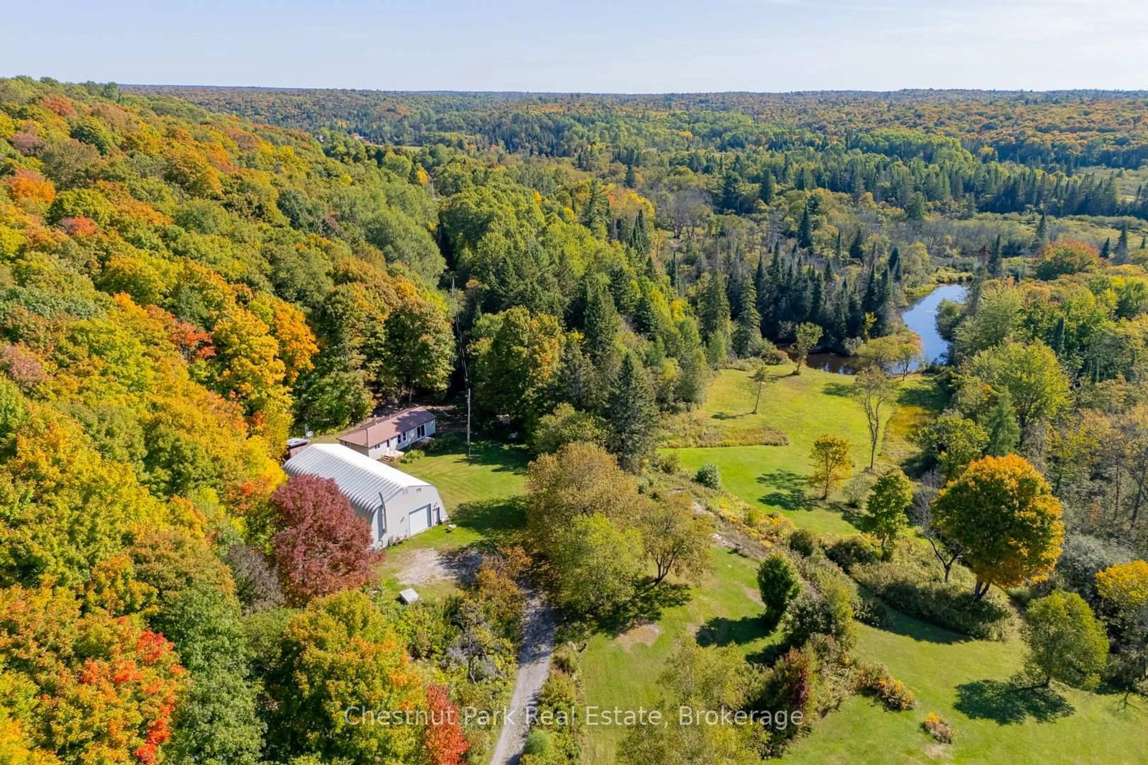 A pic from outside/outdoor area/front of a property/back of a property/a pic from drone, forest/trees view for 1190 Hekkla Rd, Muskoka Lakes Ontario P0C 1J0