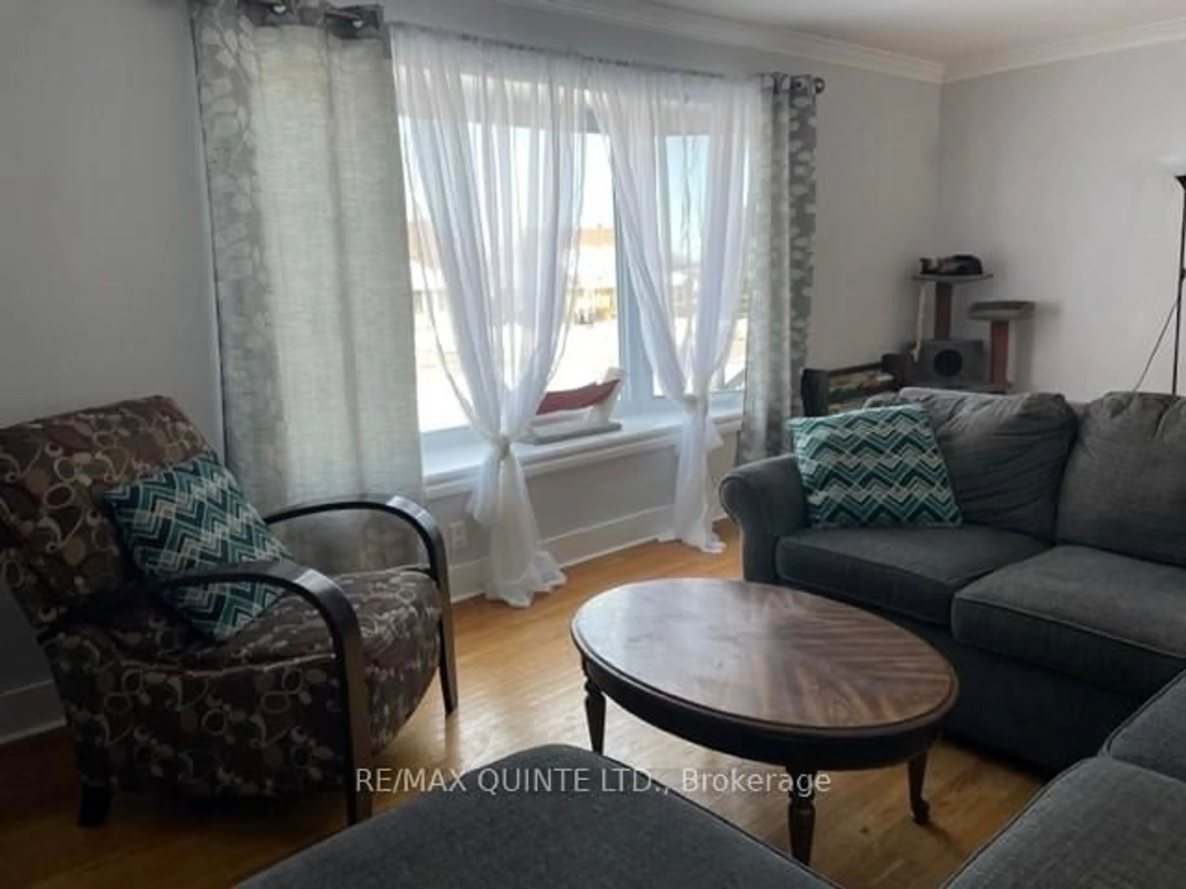 Living room with furniture, wood/laminate floor for 42 Fourth Ave, Quinte West Ontario K8V 5H7