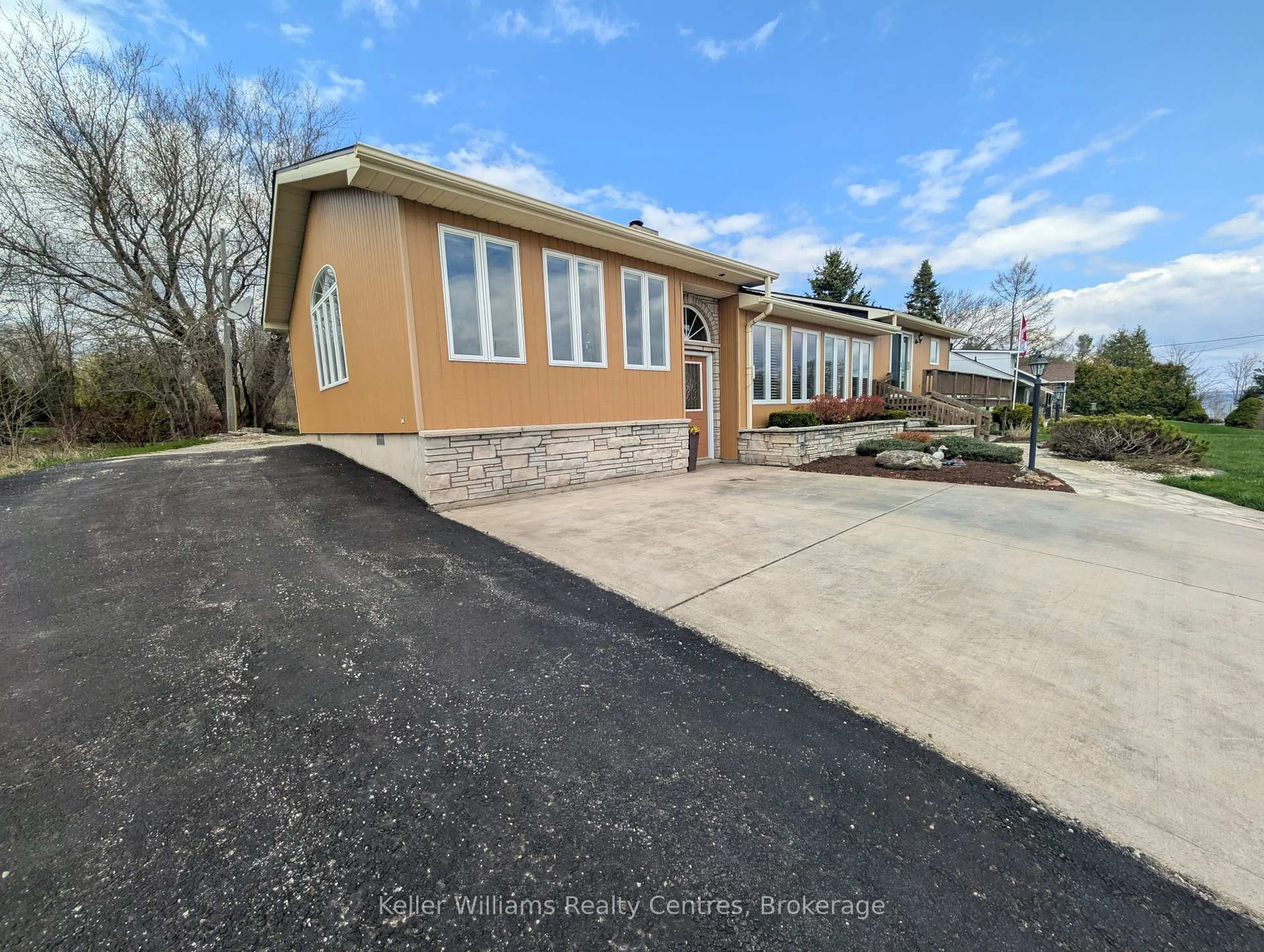 A pic from outside/outdoor area/front of a property/back of a property/a pic from drone, street for 11 Mallory Beach Rd, South Bruce Peninsula Ontario N0H 2T0