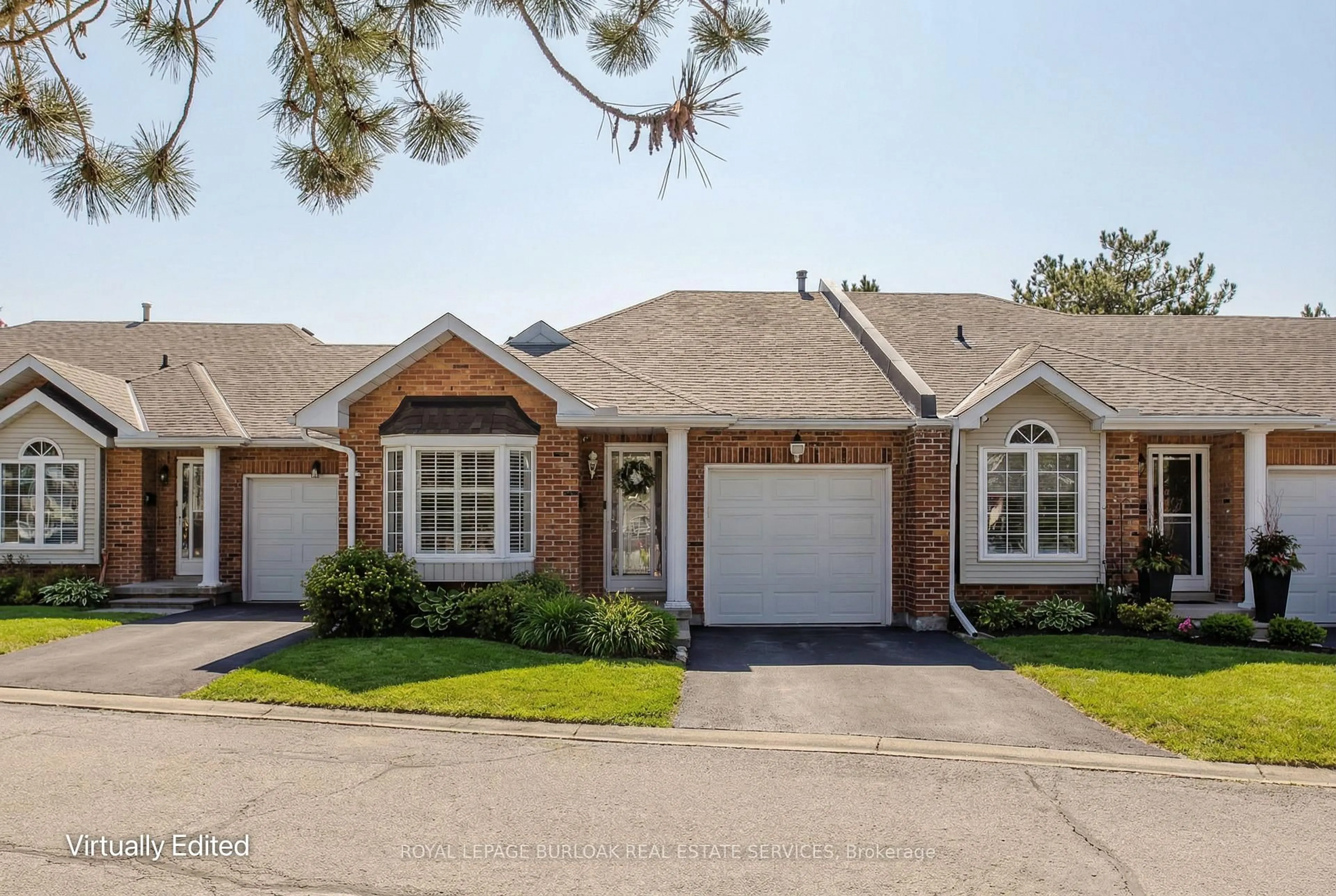 Home with brick exterior material, street for 20 Meadowlands Blvd #26, Hamilton Ontario L9K 1J5