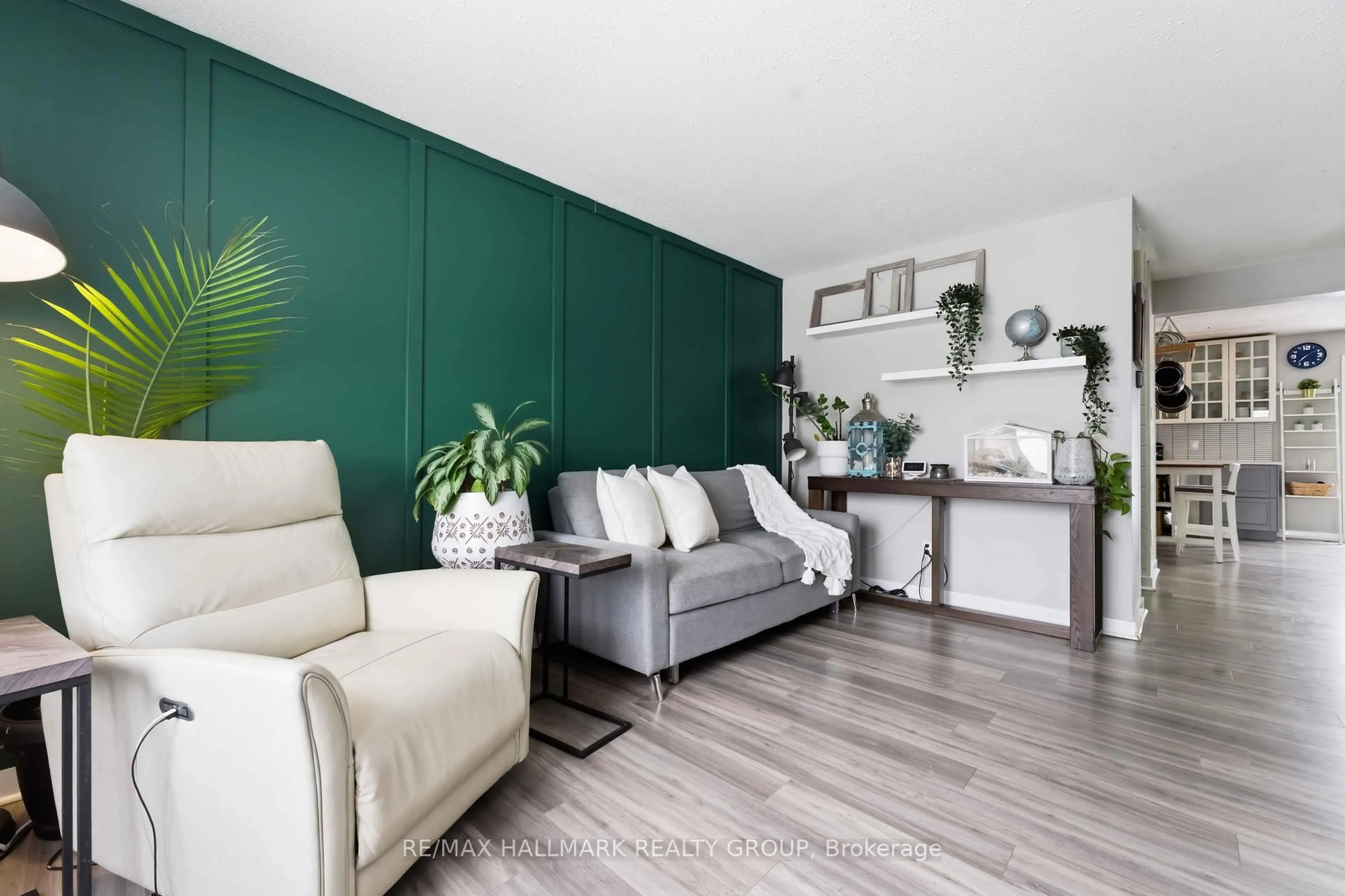 Living room with furniture, wood/laminate floor for 1091 Burgundy Lane, Orleans Ontario K1C 2M9