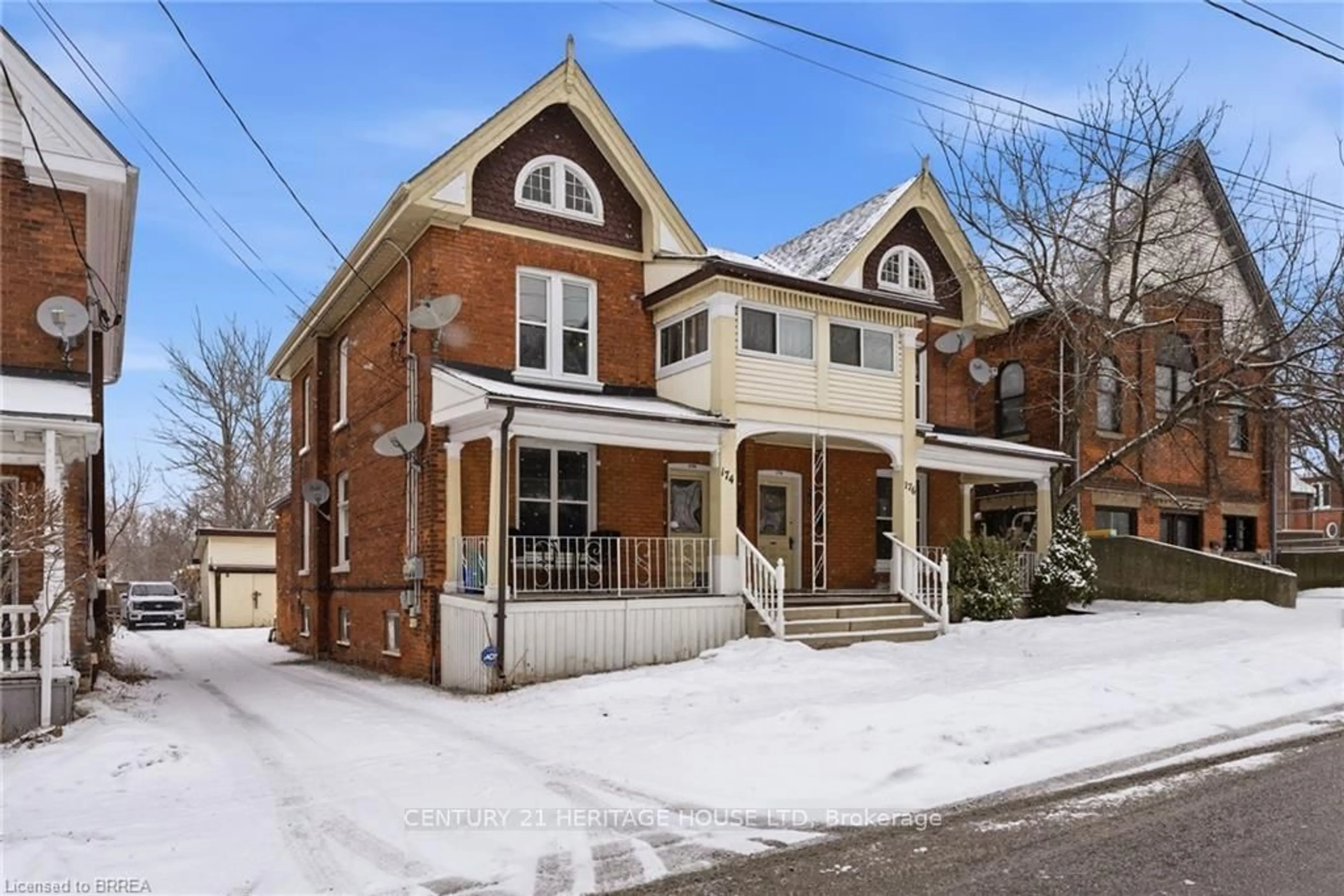 Home with brick exterior material, street for 174-176 Darling St, Brantford Ontario N3S 3W6