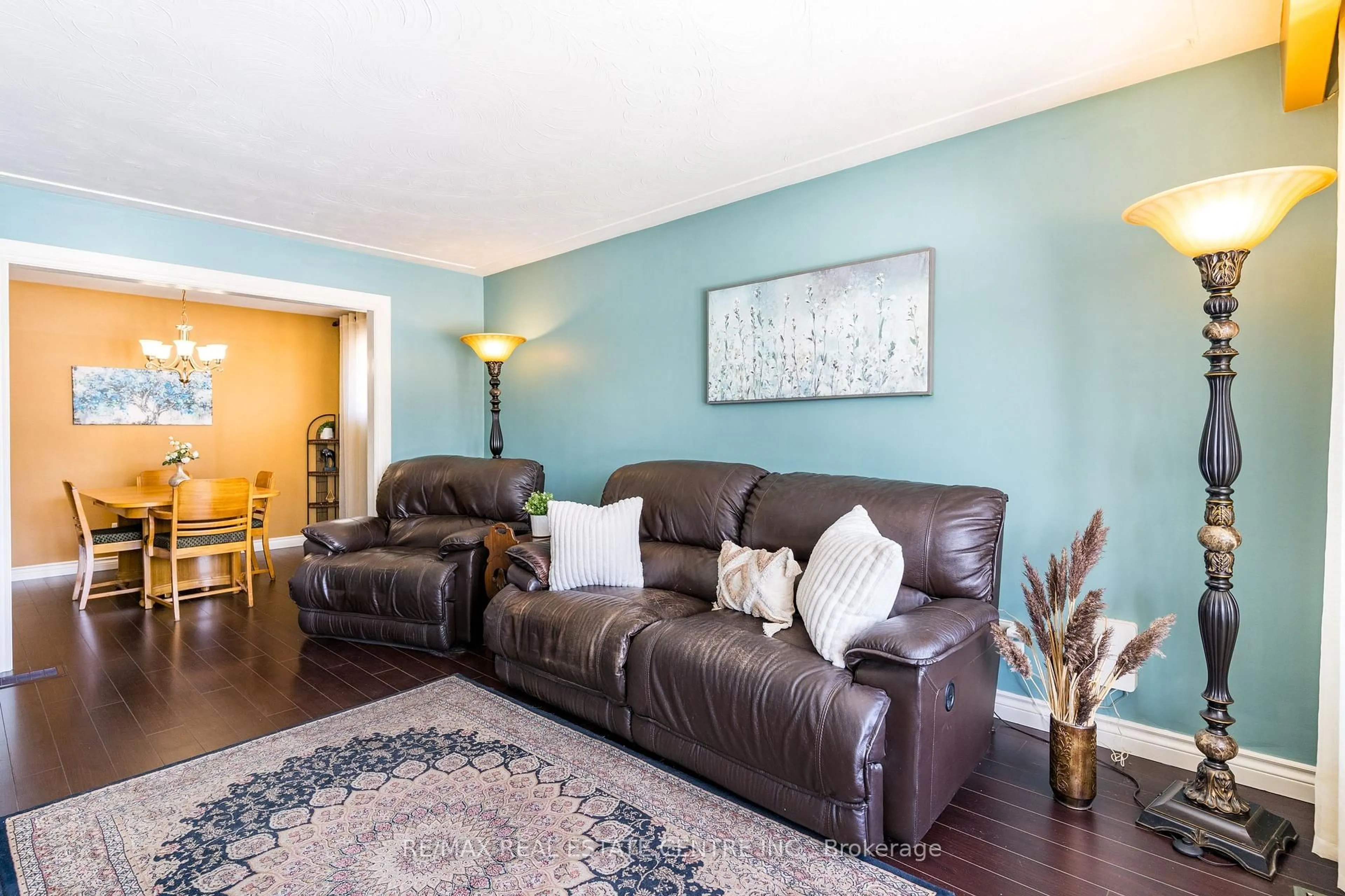 Living room with furniture, wood/laminate floor for 102 Greeningdon Dr, Hamilton Ontario L9A 3A7
