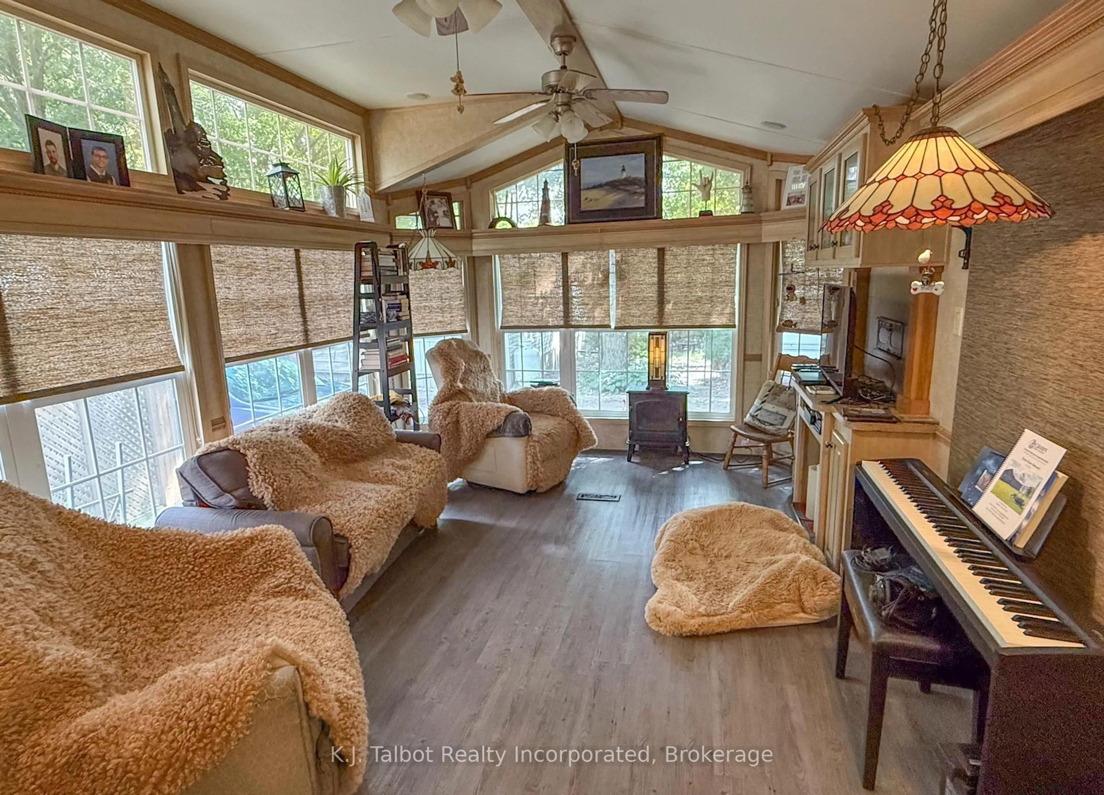 Living room with furniture, wood/laminate floor for 77719 BLUEWATER Highway #36 BEACON LN, Bluewater Ontario N0M 1G0