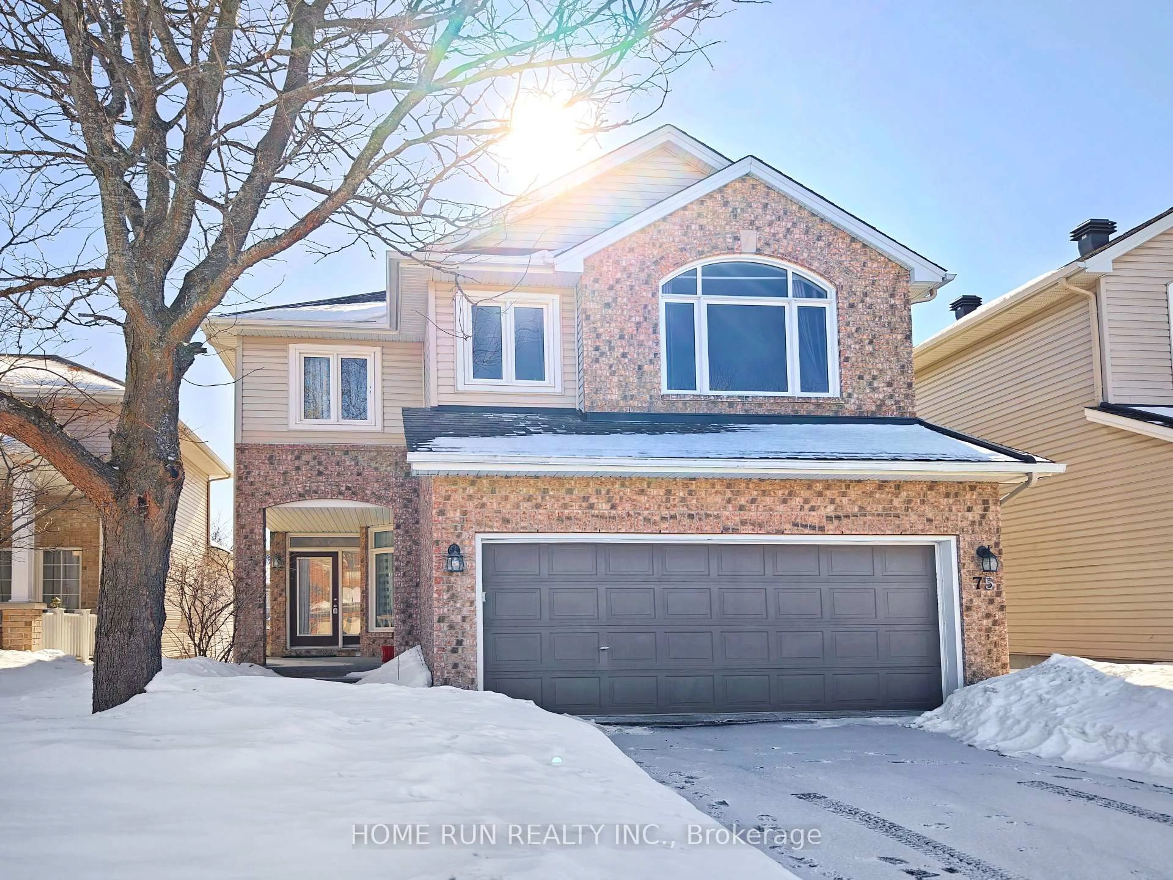 Home with brick exterior material, street for 75 Polo Lane, Ottawa Ontario K2M 2Y4