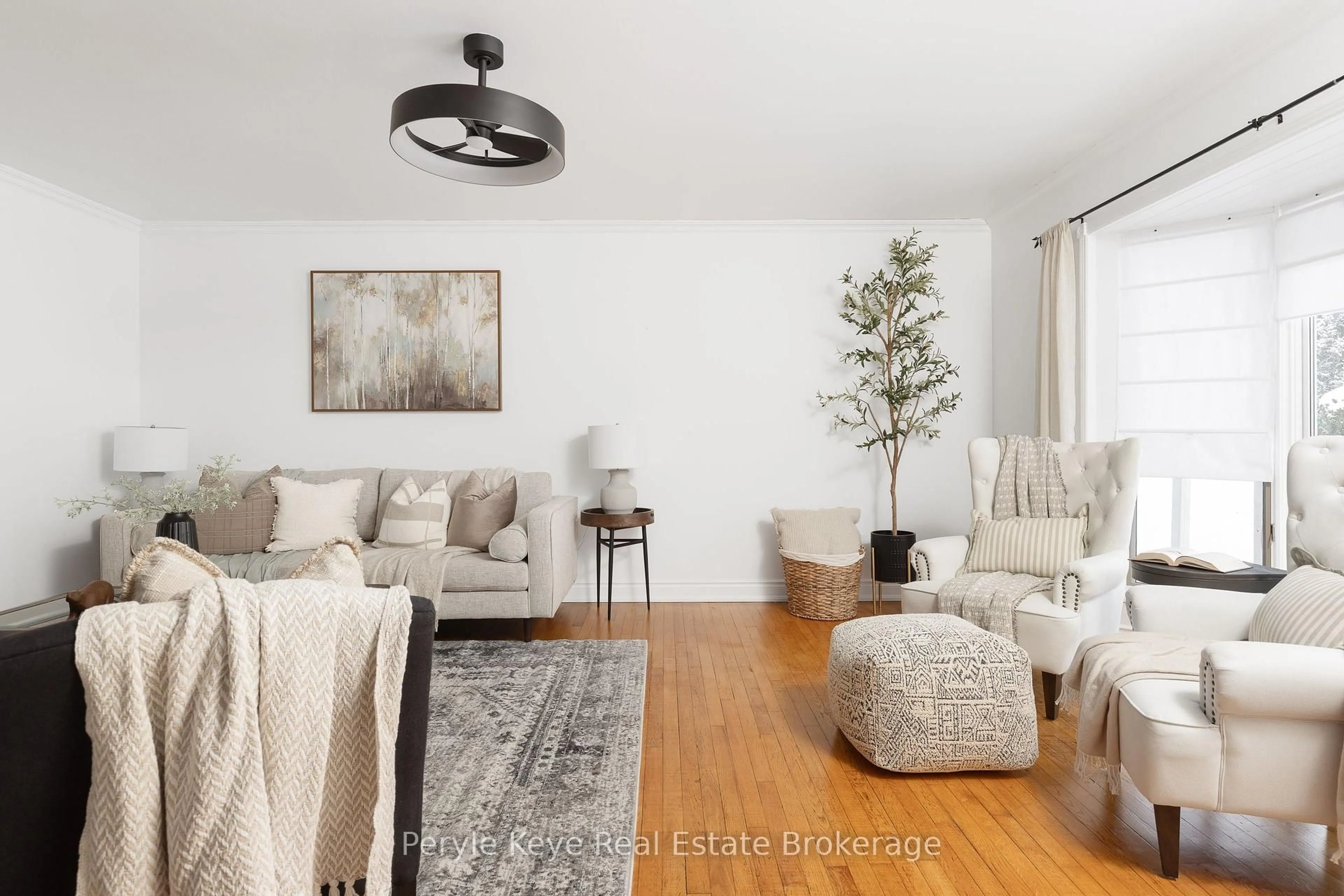 Living room with furniture, wood/laminate floor for 11 Silverwood Dr, Huntsville Ontario P1H 1N1