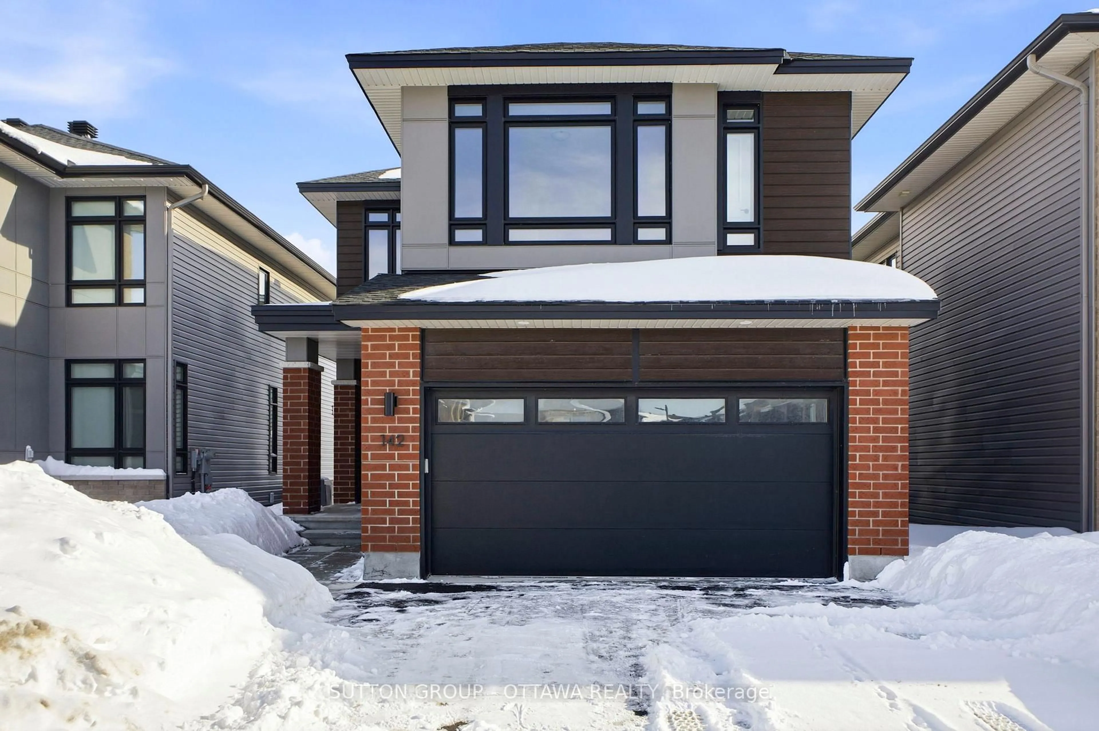 Home with brick exterior material, street for 142 Shuttleworth Dr, Ottawa Ontario K1T 0S8