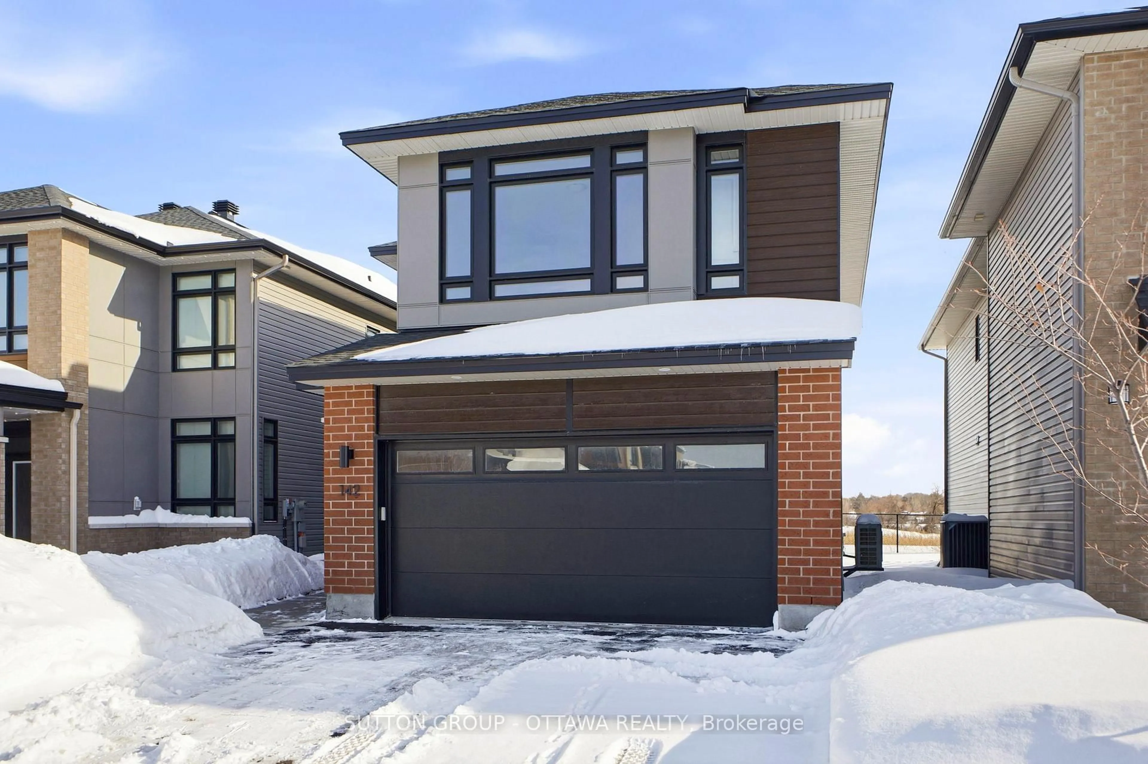 Home with brick exterior material, street for 142 Shuttleworth Dr, Ottawa Ontario K1T 0S8
