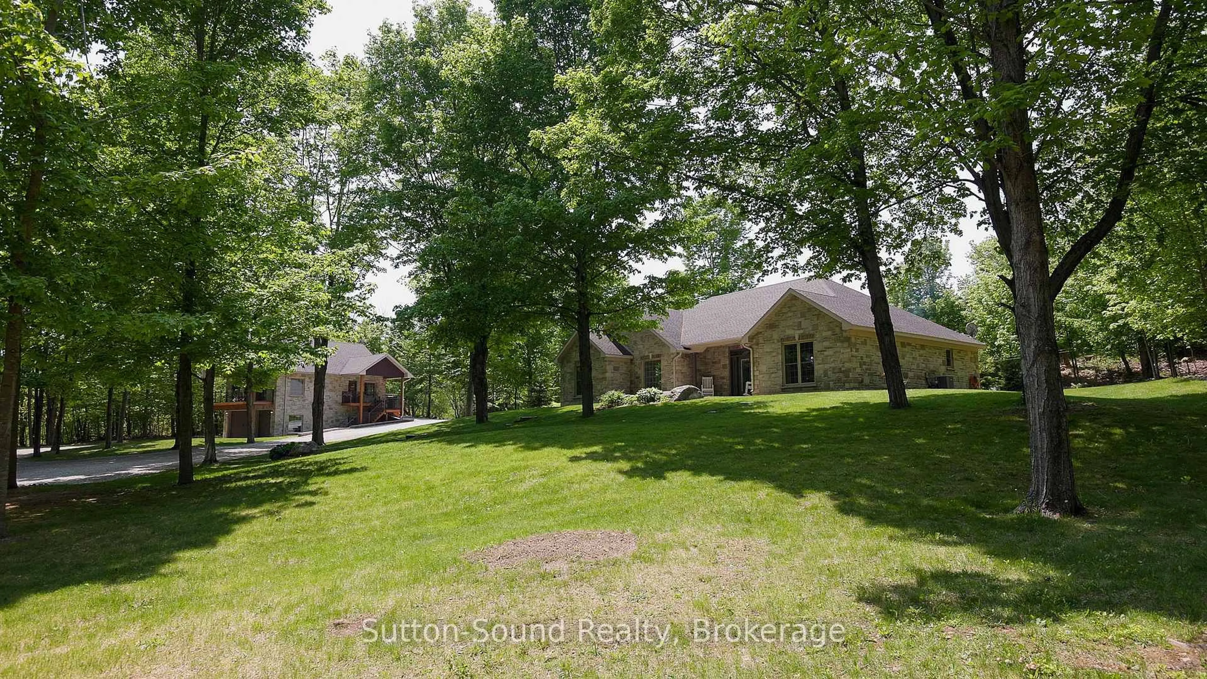 A pic from outside/outdoor area/front of a property/back of a property/a pic from drone, unknown for 505556 Grey Road 1 Rd, Georgian Bluffs Ontario N0H 1S0