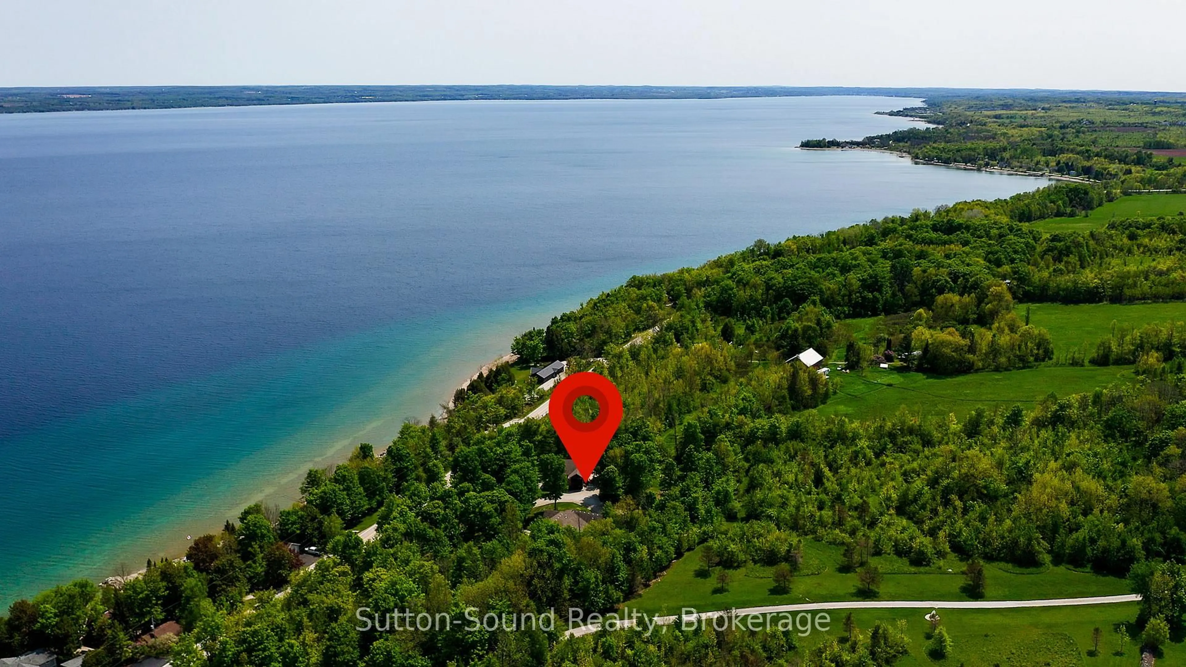 A pic from outside/outdoor area/front of a property/back of a property/a pic from drone, water/lake/river/ocean view for 505556 Grey Road 1 Rd, Georgian Bluffs Ontario N0H 1S0