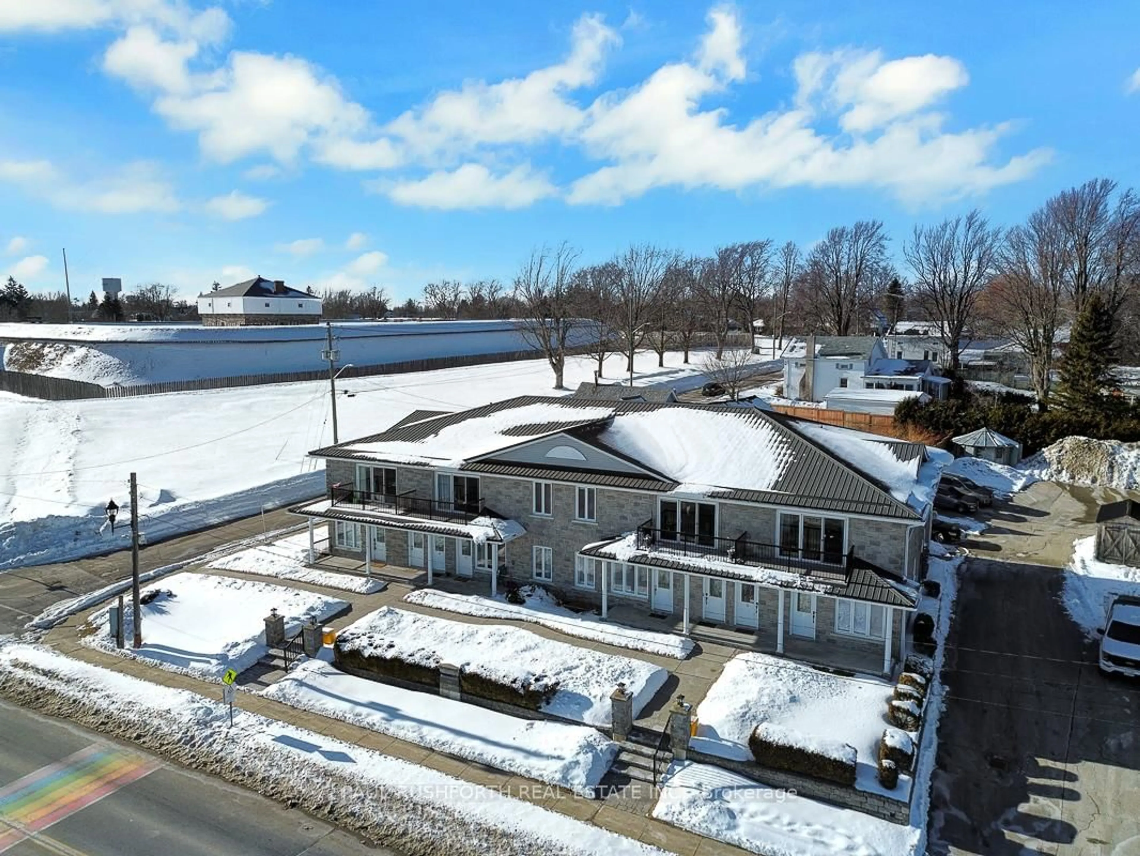 A pic from outside/outdoor area/front of a property/back of a property/a pic from drone, water/lake/river/ocean view for 410 KING St #7, Prescott Ontario K0E 1T0
