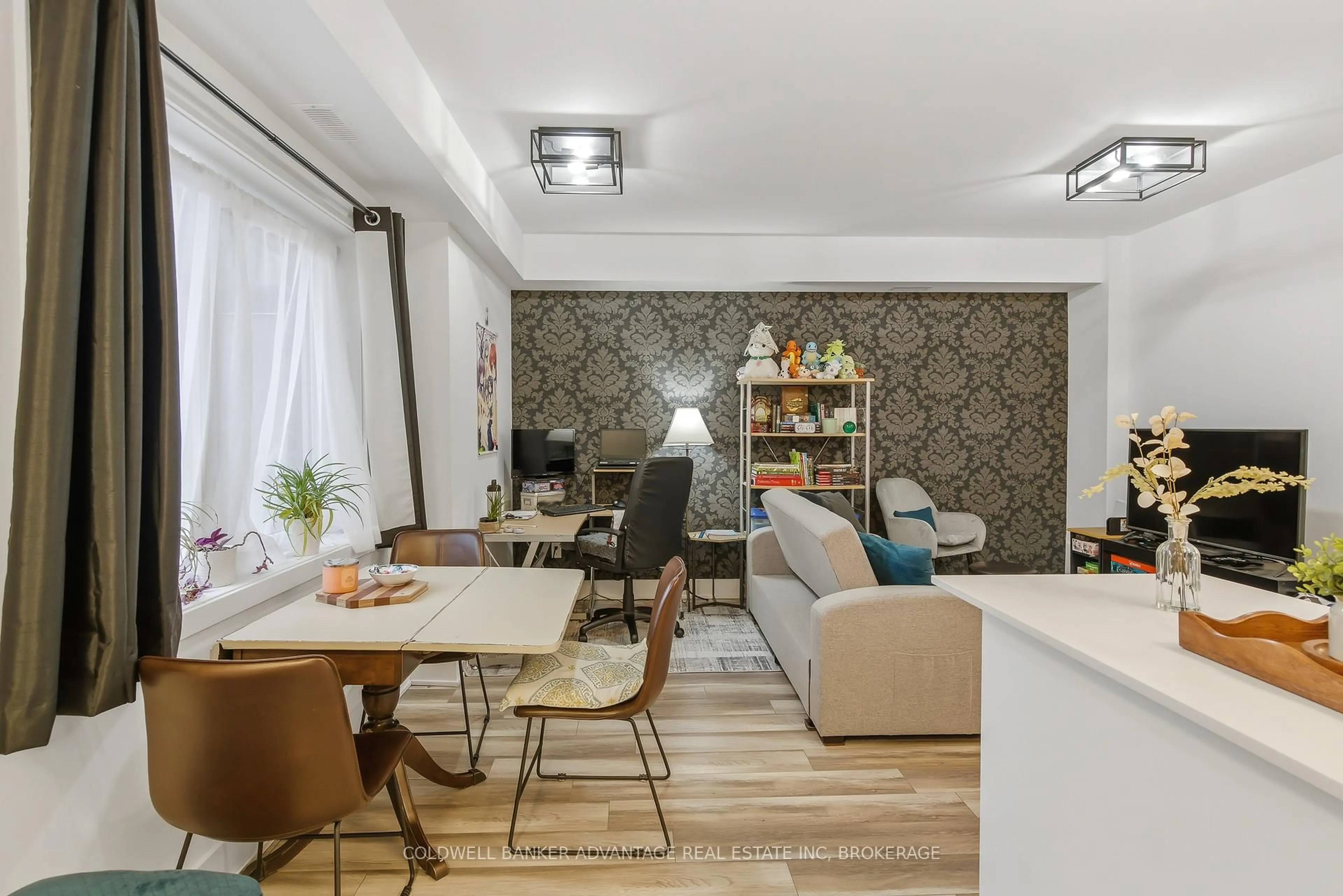 Living room with furniture, unknown for 6065 McLeod Rd #103, Niagara Falls Ontario L2G 0Z7