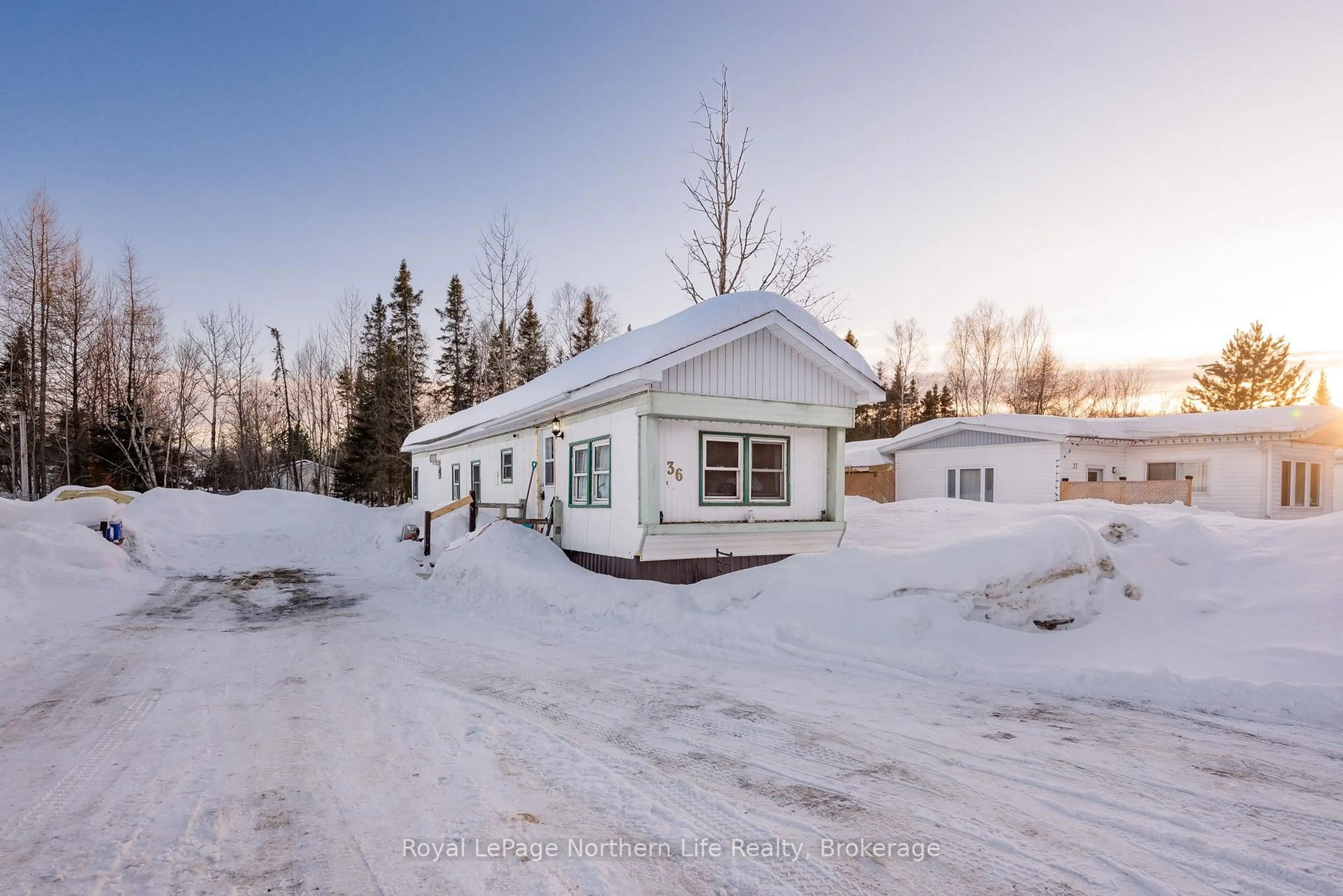 A pic from outside/outdoor area/front of a property/back of a property/a pic from drone, street for 5887 Highway 11 #36, North Bay Ontario P1B 8G3