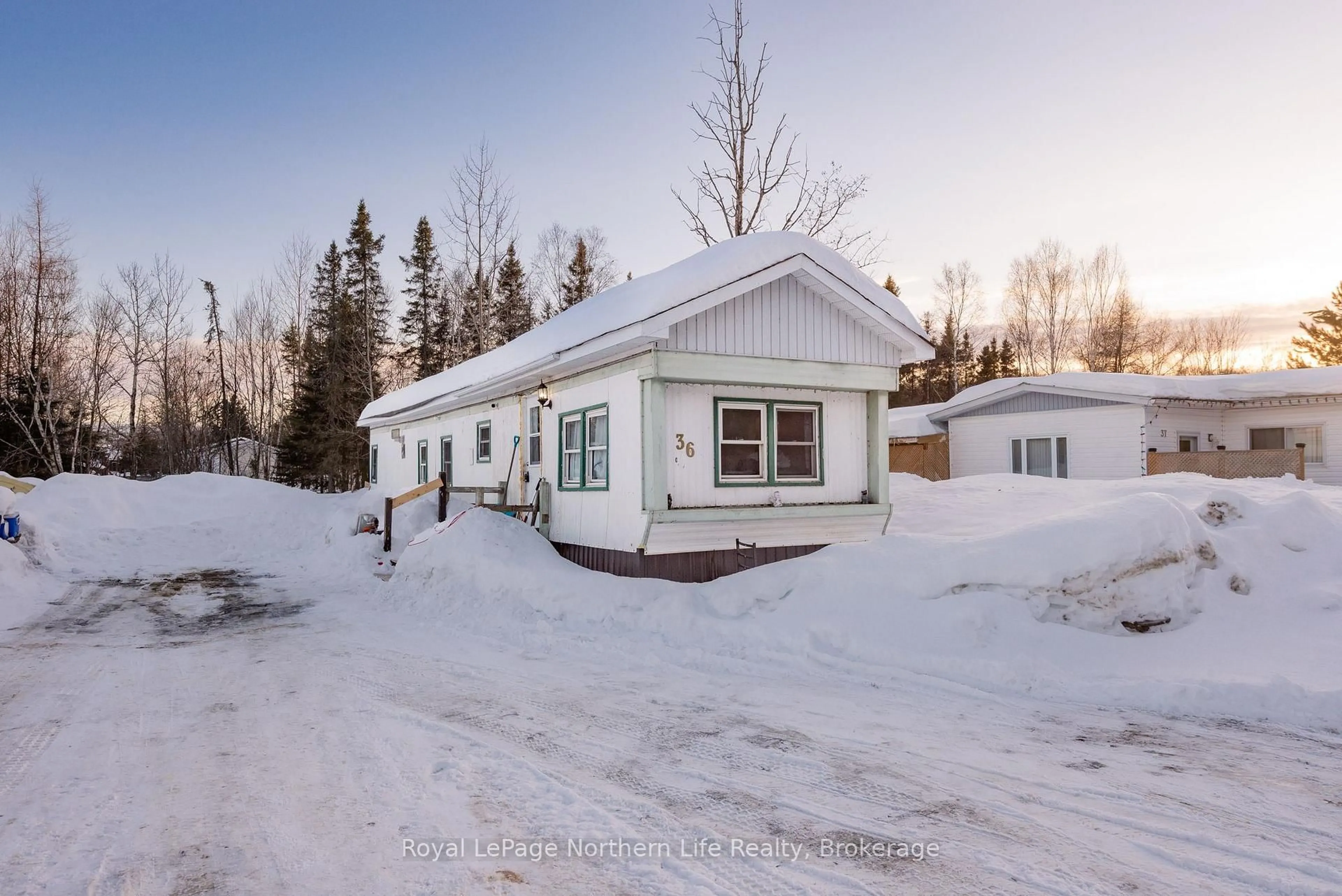 A pic from outside/outdoor area/front of a property/back of a property/a pic from drone, street for 5887 Highway 11 #36, North Bay Ontario P1B 8G3