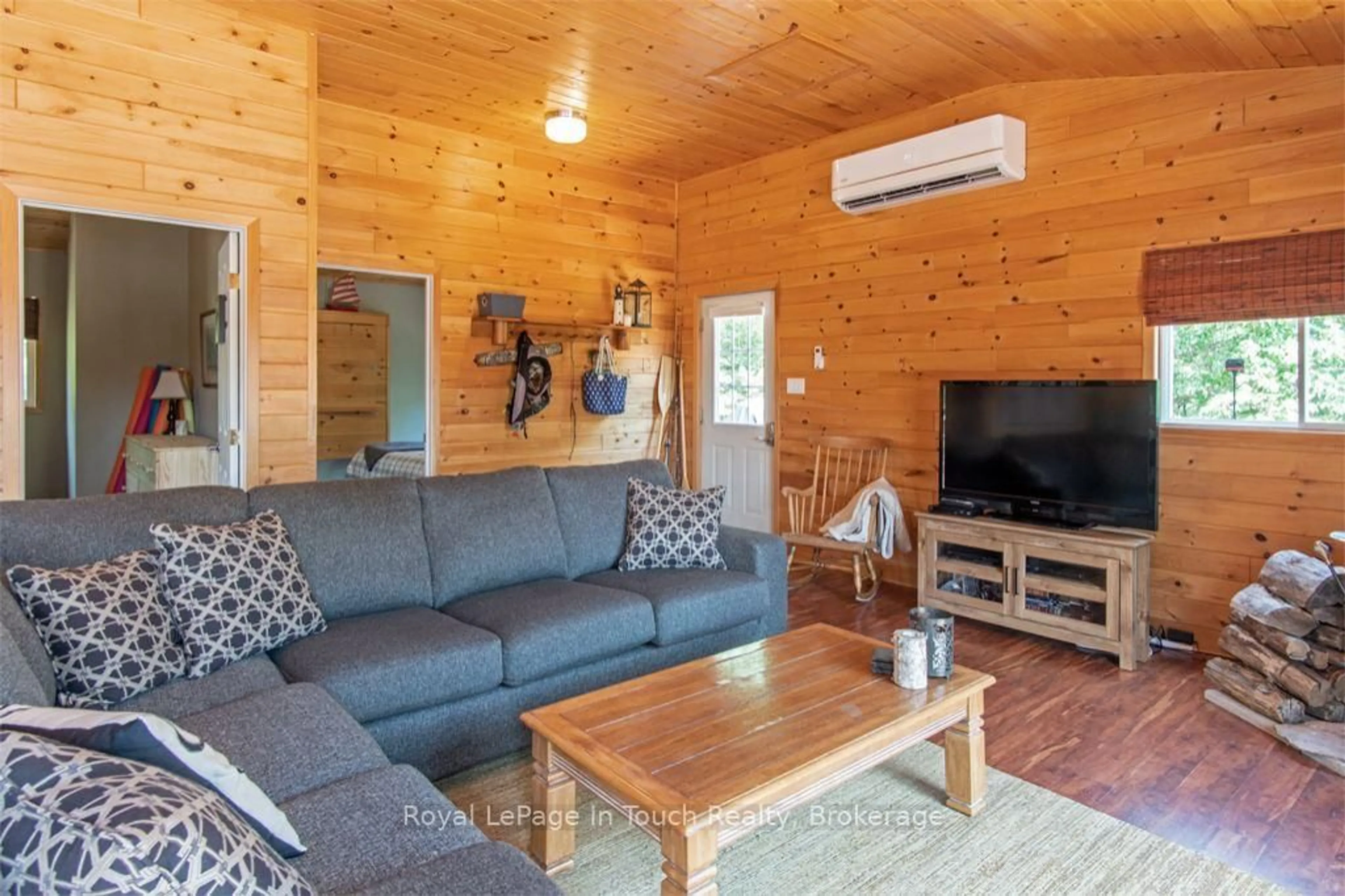 Living room with furniture, wood/laminate floor for 2974 Island 1040, Georgian Bay Ontario P0E 1E0