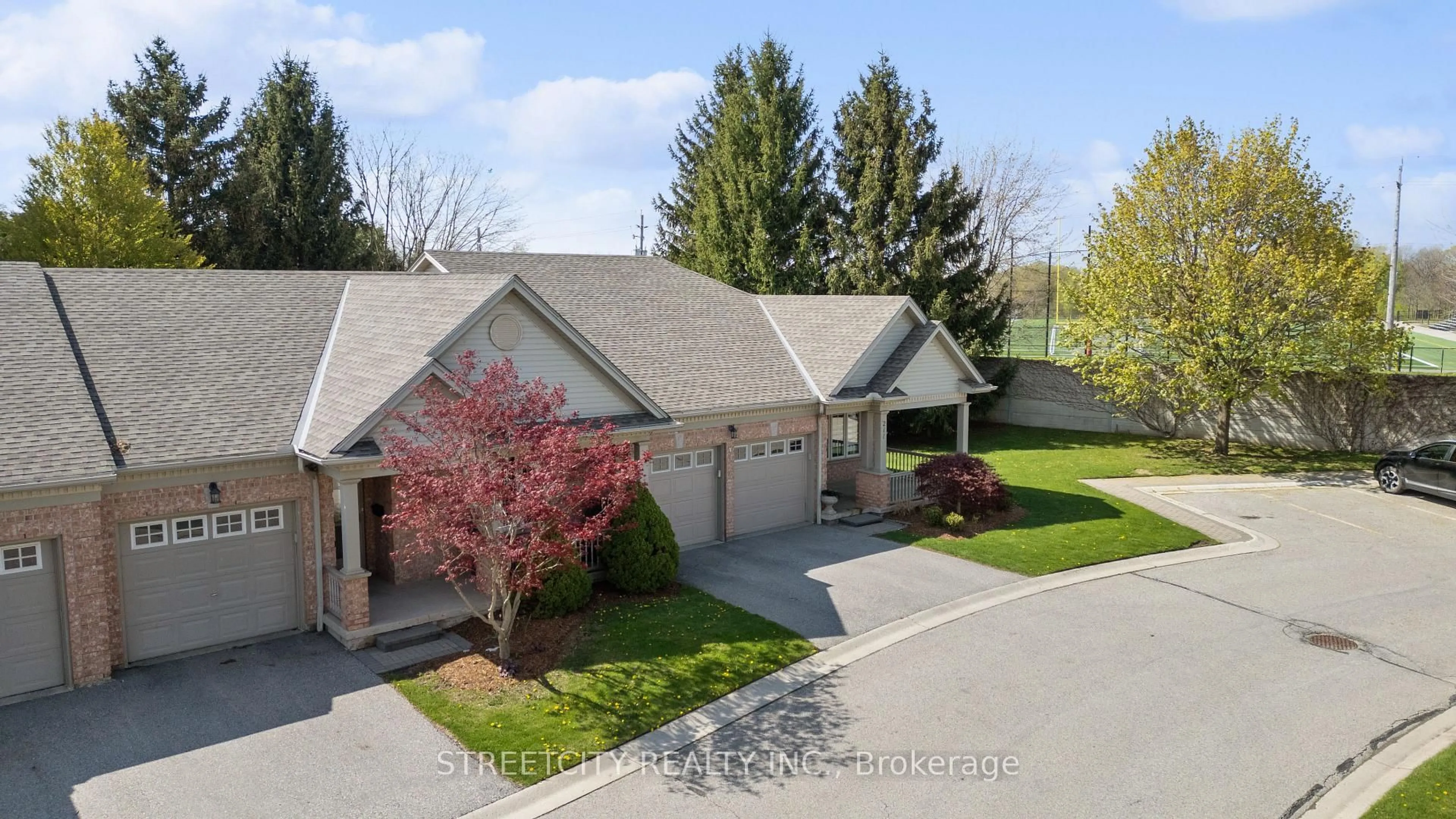 A pic from outside/outdoor area/front of a property/back of a property/a pic from drone, street for 2025 Meadowgate Blvd #211, London South Ontario N6M 1K9