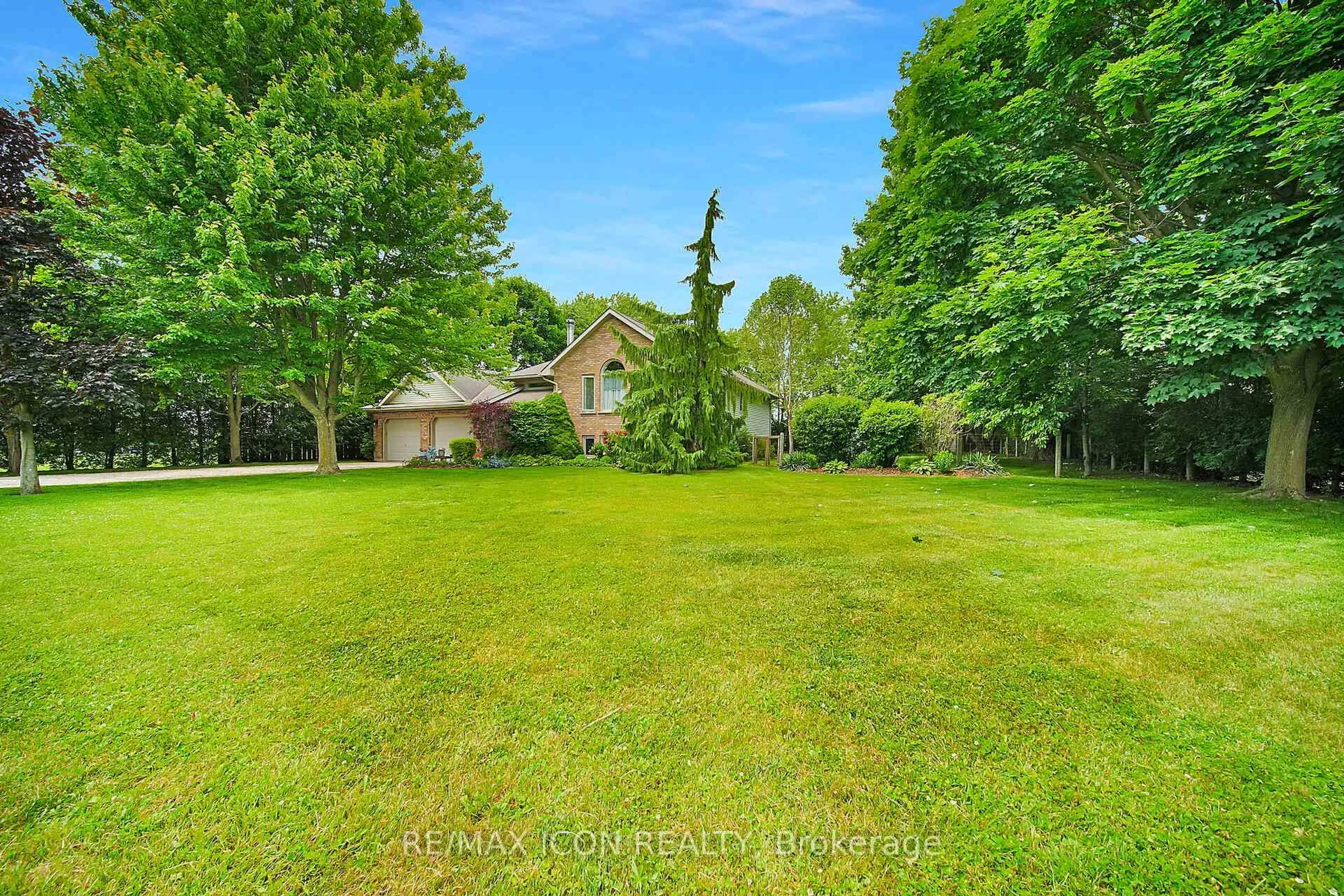 A pic from outside/outdoor area/front of a property/back of a property/a pic from drone, forest/trees view for 21 Lunn Lane, Dutton/Dunwich Ontario N0L 2M0