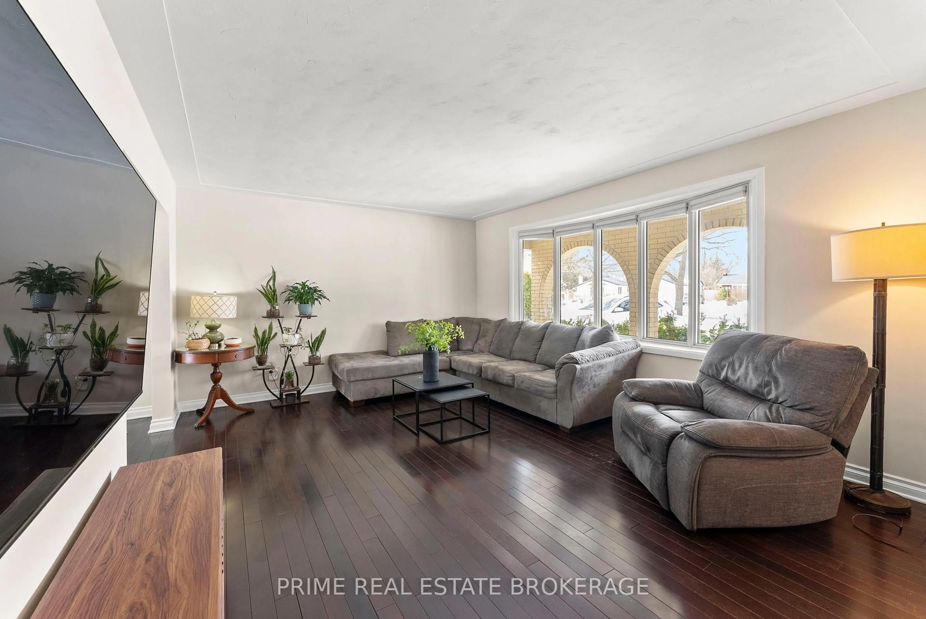 Living room with furniture, wood/laminate floor for 696 Algoma Pl, London North Ontario N5X 1W6