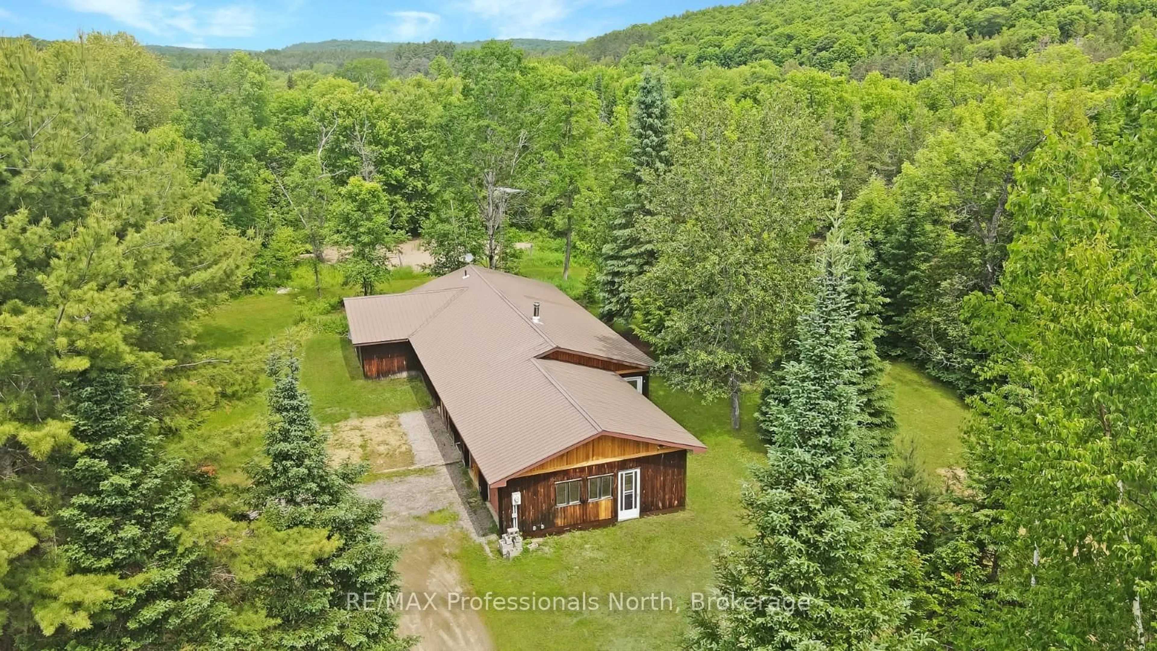 A pic from outside/outdoor area/front of a property/back of a property/a pic from drone, unknown for 11601 Highway 118 Highway, Dysart et al Ontario K0M 1S0