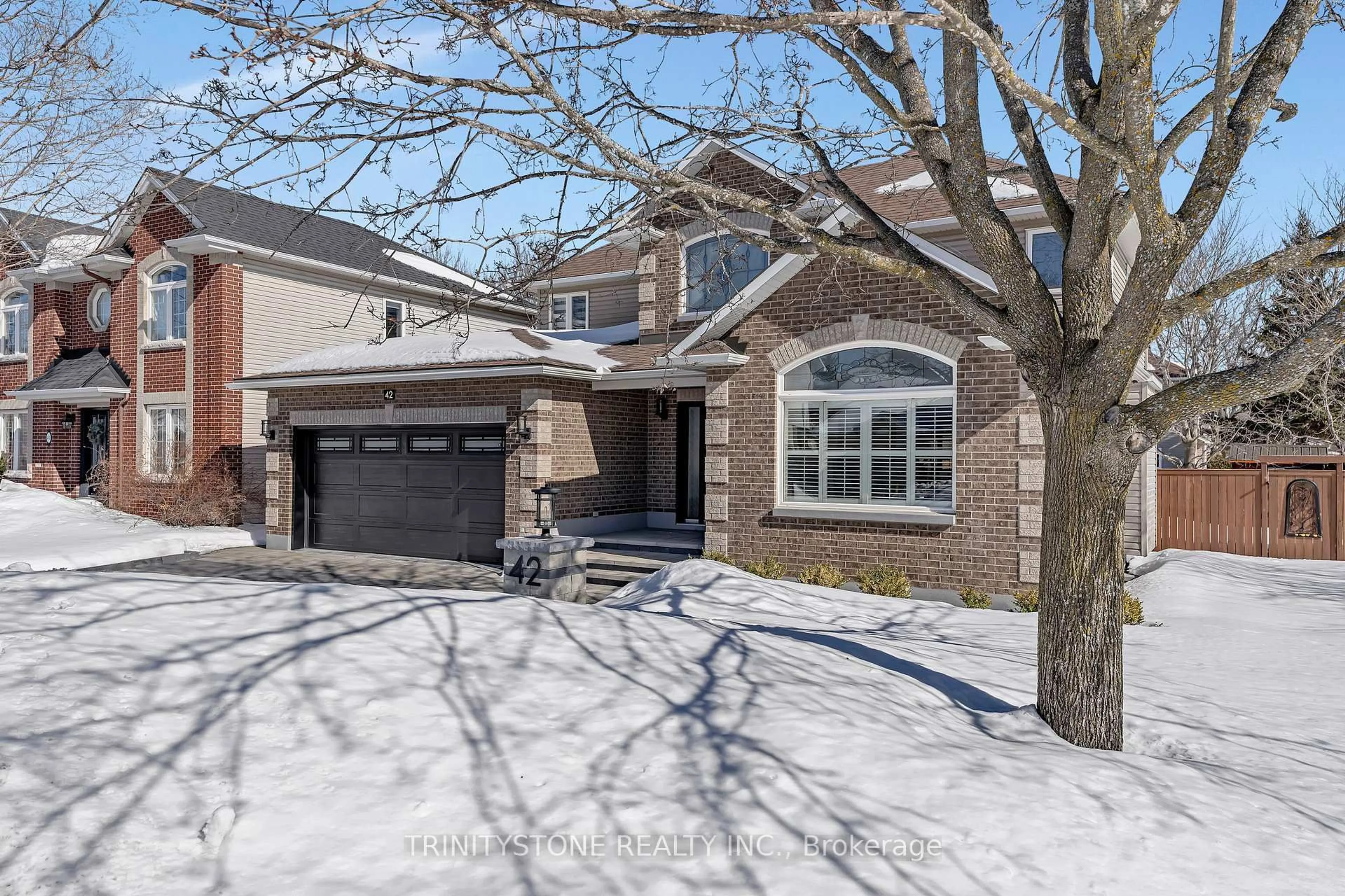Home with brick exterior material, street for 42 Heritage Grove Cres, Ottawa Ontario K2S 1R2