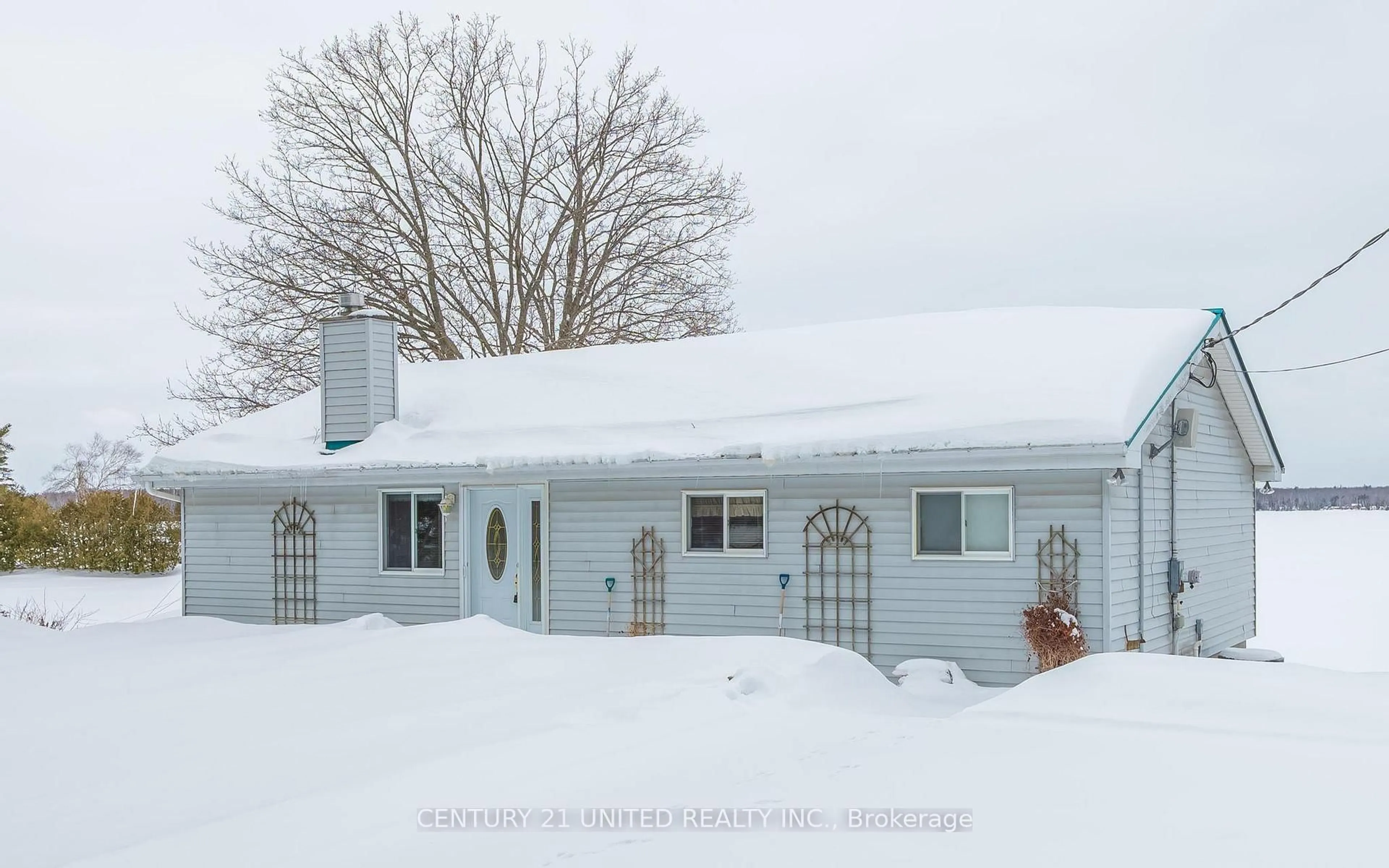 Home with vinyl exterior material, street for 2412 Upper Chemong Dr, Selwyn Ontario K0L 2H0