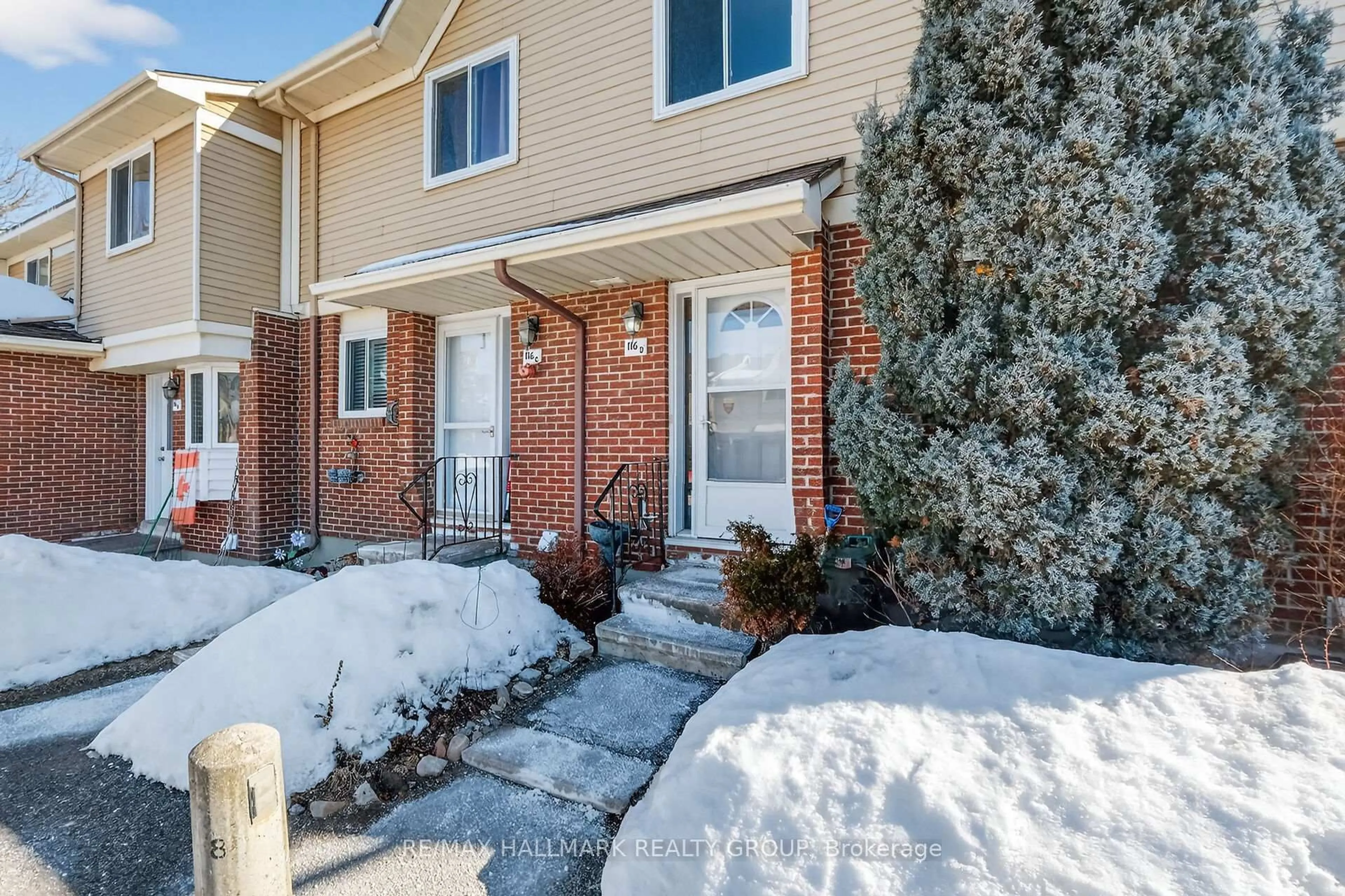 Home with brick exterior material, street for 116 Valley Stream Dr #D, Ottawa Ontario K2H 9E1