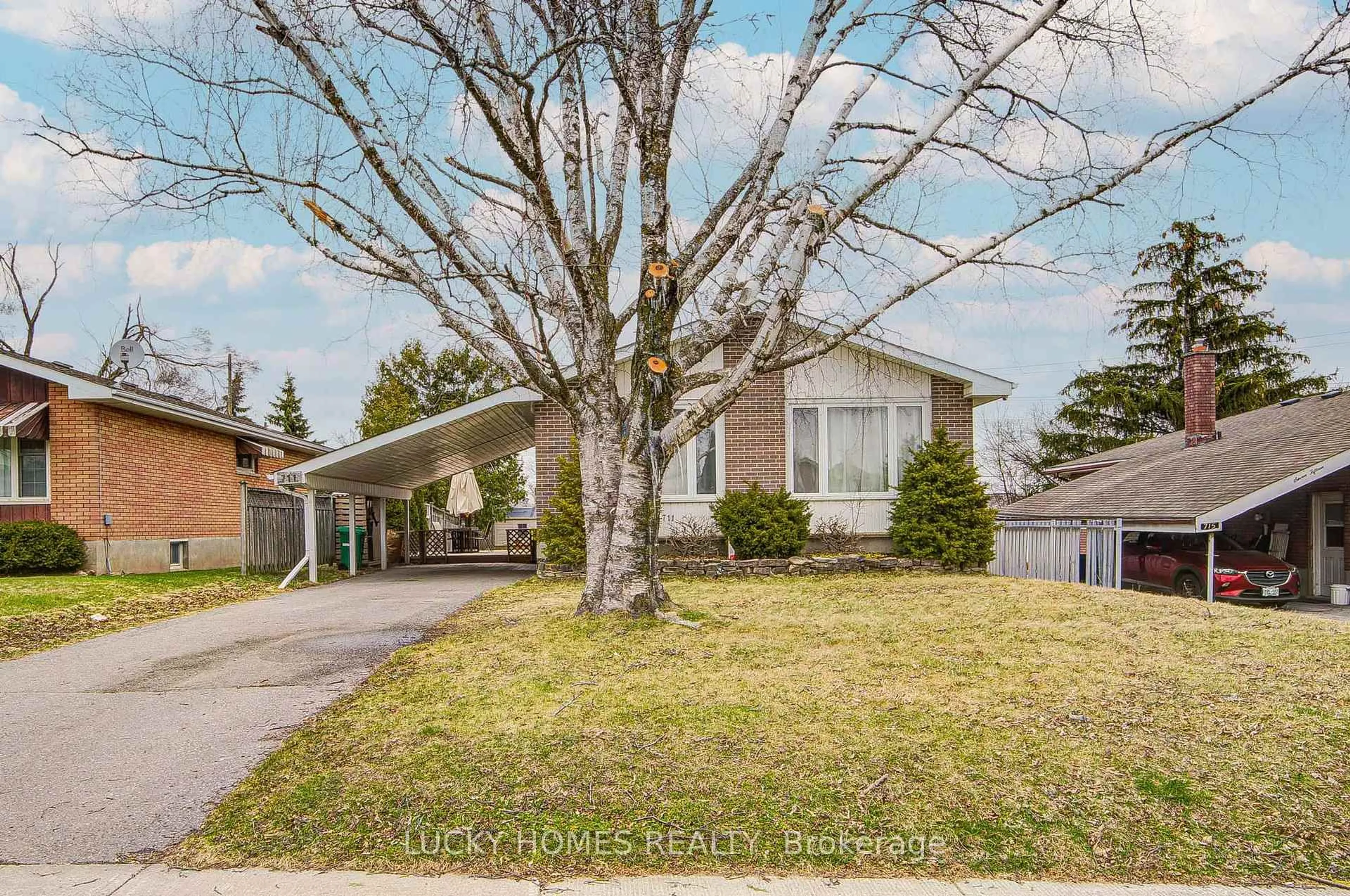 Home with vinyl exterior material, street for 711 Otonabee Dr, Peterborough Ontario M1B 6B2