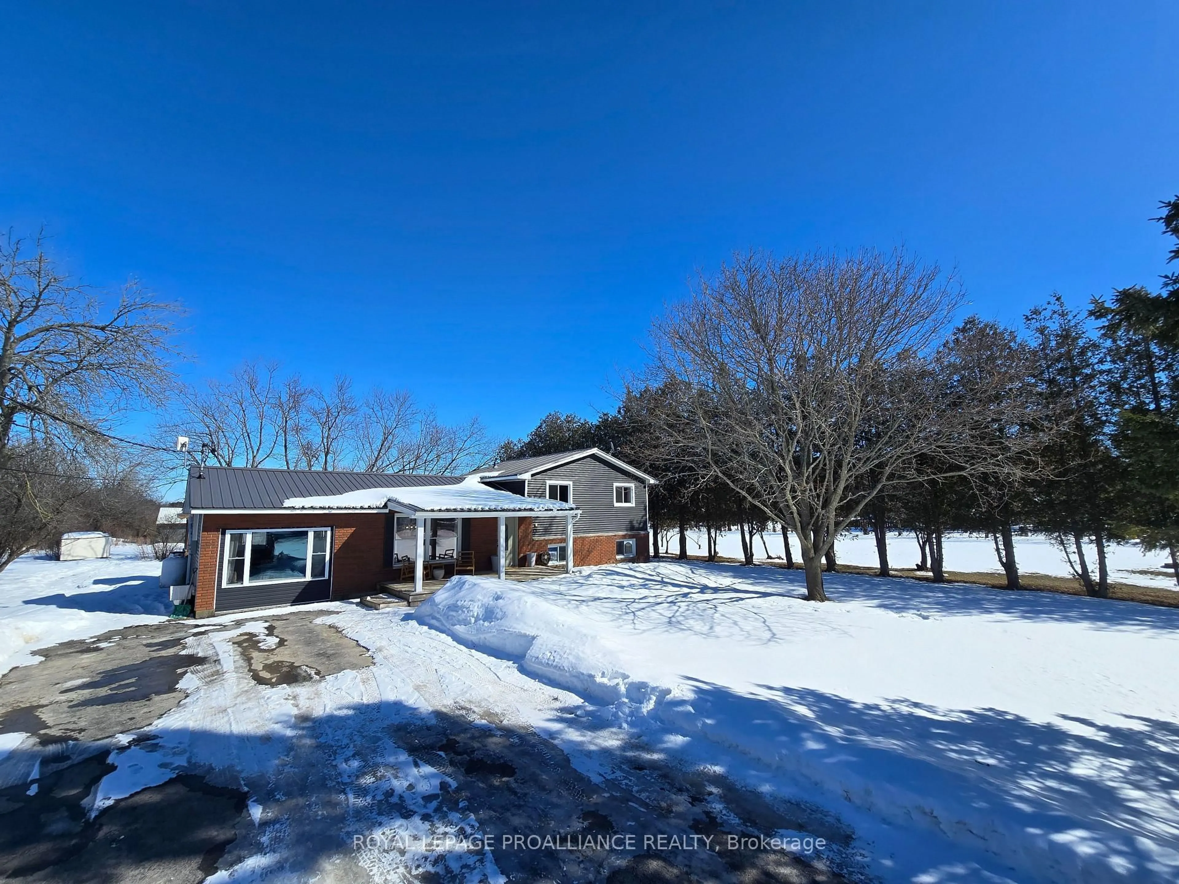 A pic from outside/outdoor area/front of a property/back of a property/a pic from drone, street for 1099 Wilson Rd, Prince Edward County Ontario K0K 2J0