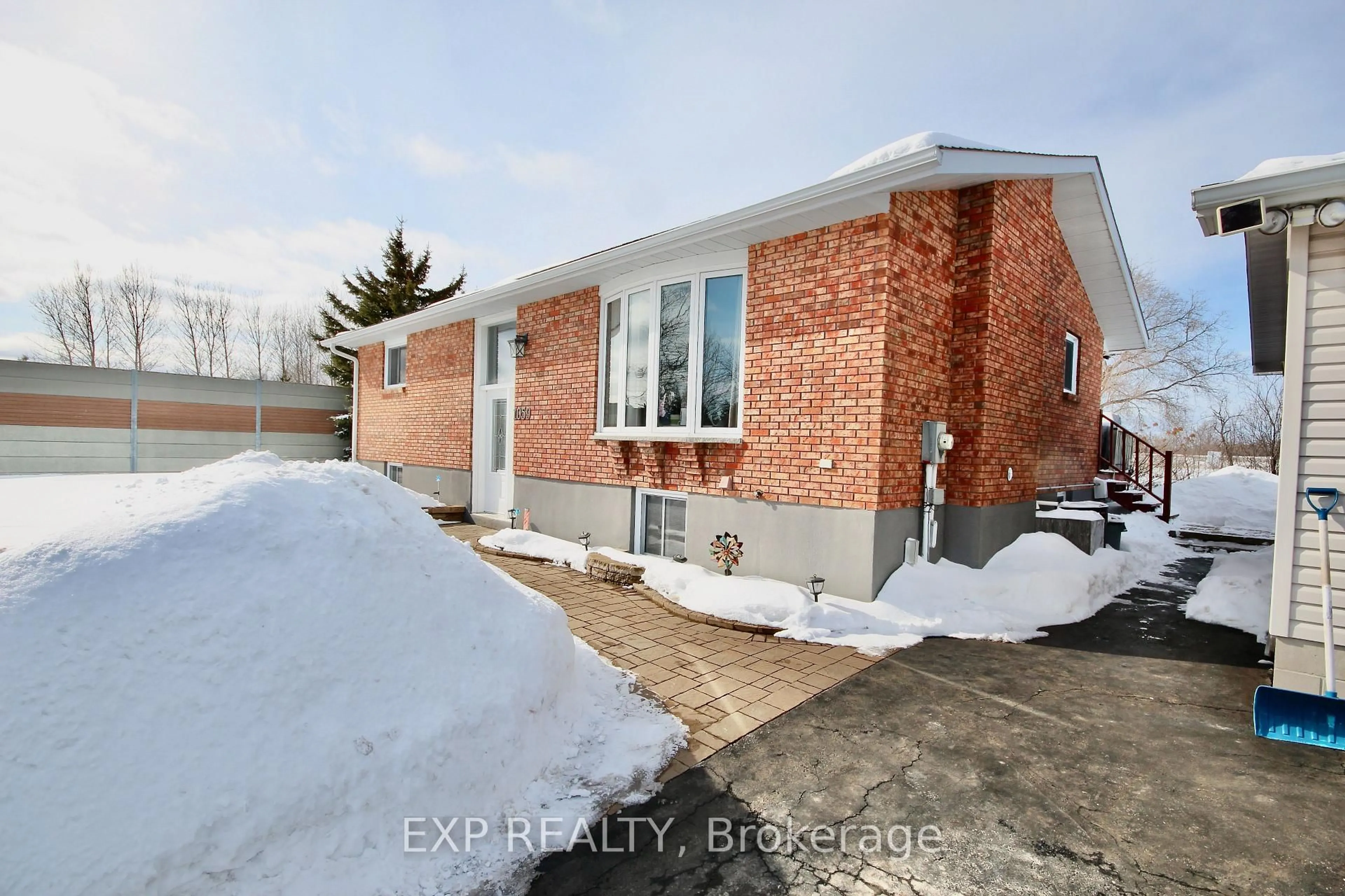 Home with brick exterior material, street for 1059 Flynn Ave, Ottawa Ontario K7S 3G7