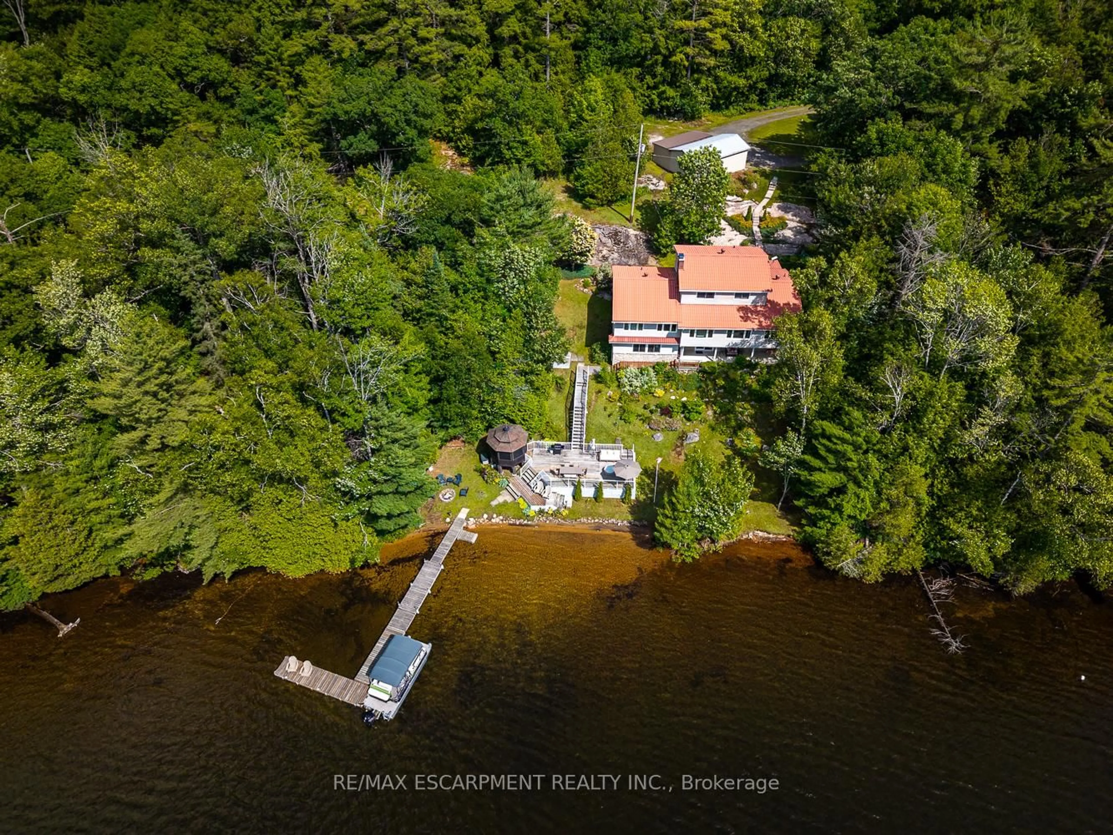 A pic from outside/outdoor area/front of a property/back of a property/a pic from drone, water/lake/river/ocean view for 32 10th Concession Rd, Seguin Ontario P2A 2W8