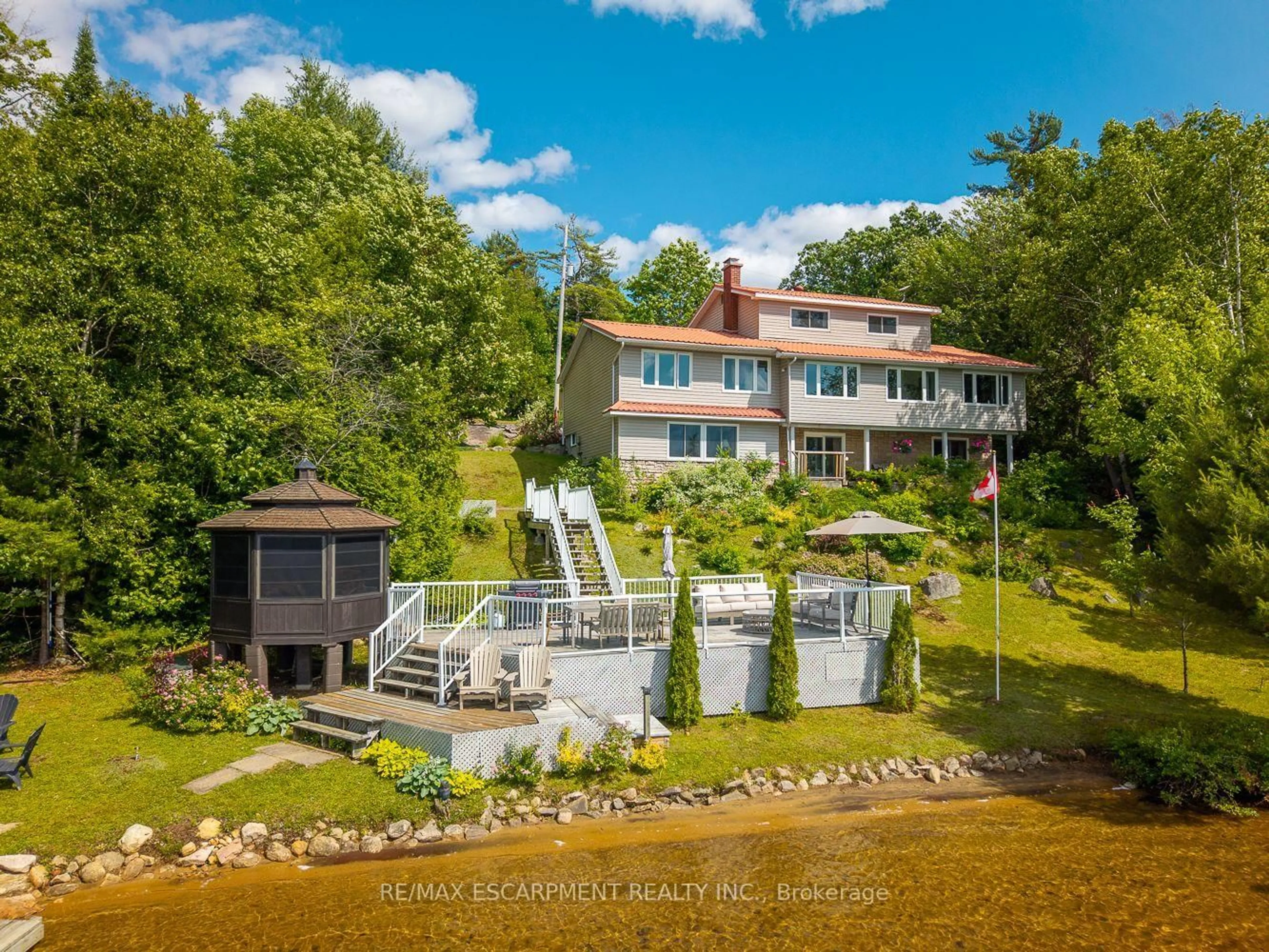 A pic from outside/outdoor area/front of a property/back of a property/a pic from drone, water/lake/river/ocean view for 32 10th Concession Rd, Seguin Ontario P2A 2W8