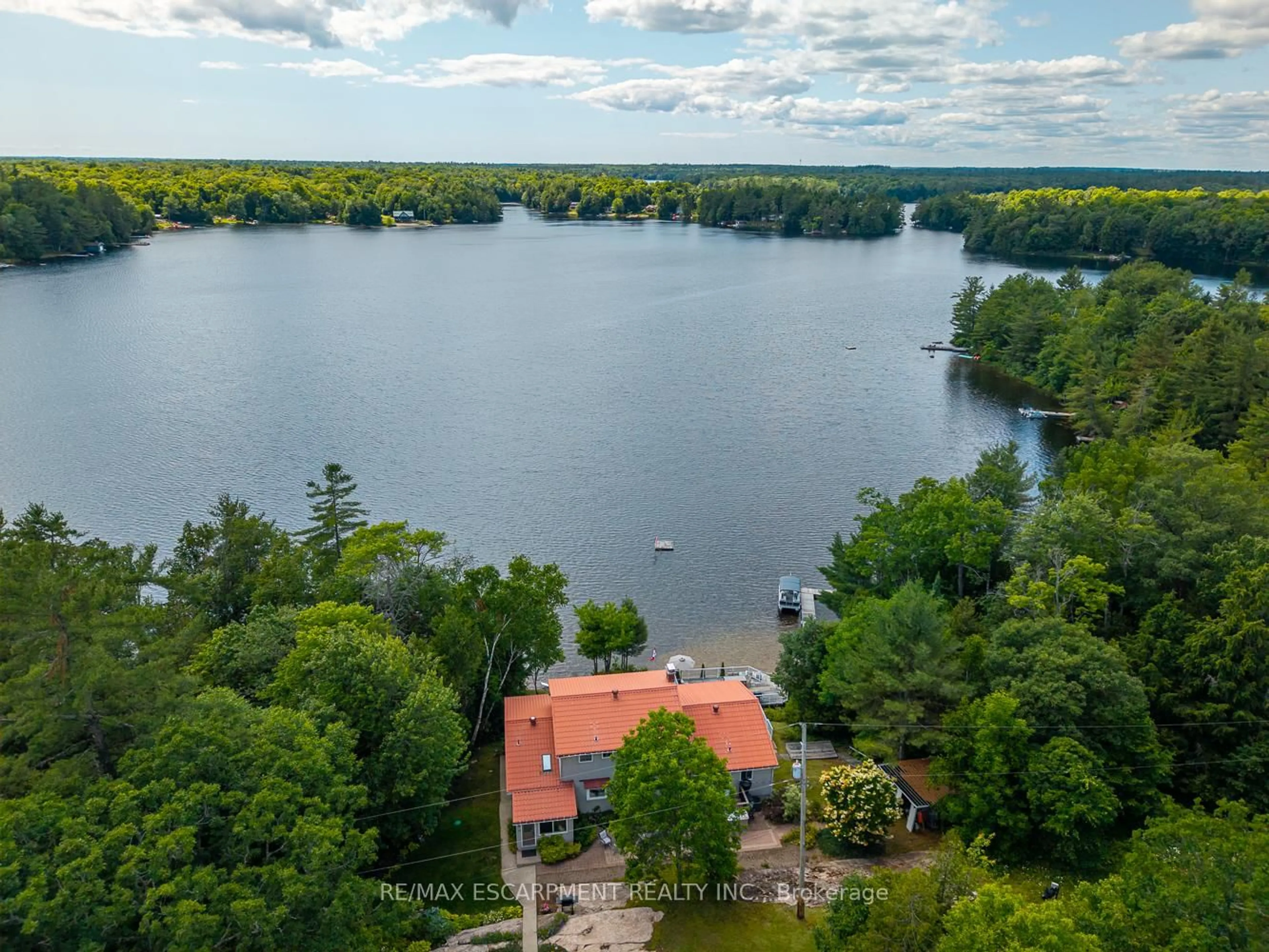 A pic from outside/outdoor area/front of a property/back of a property/a pic from drone, water/lake/river/ocean view for 32 10th Concession Rd, Seguin Ontario P2A 2W8