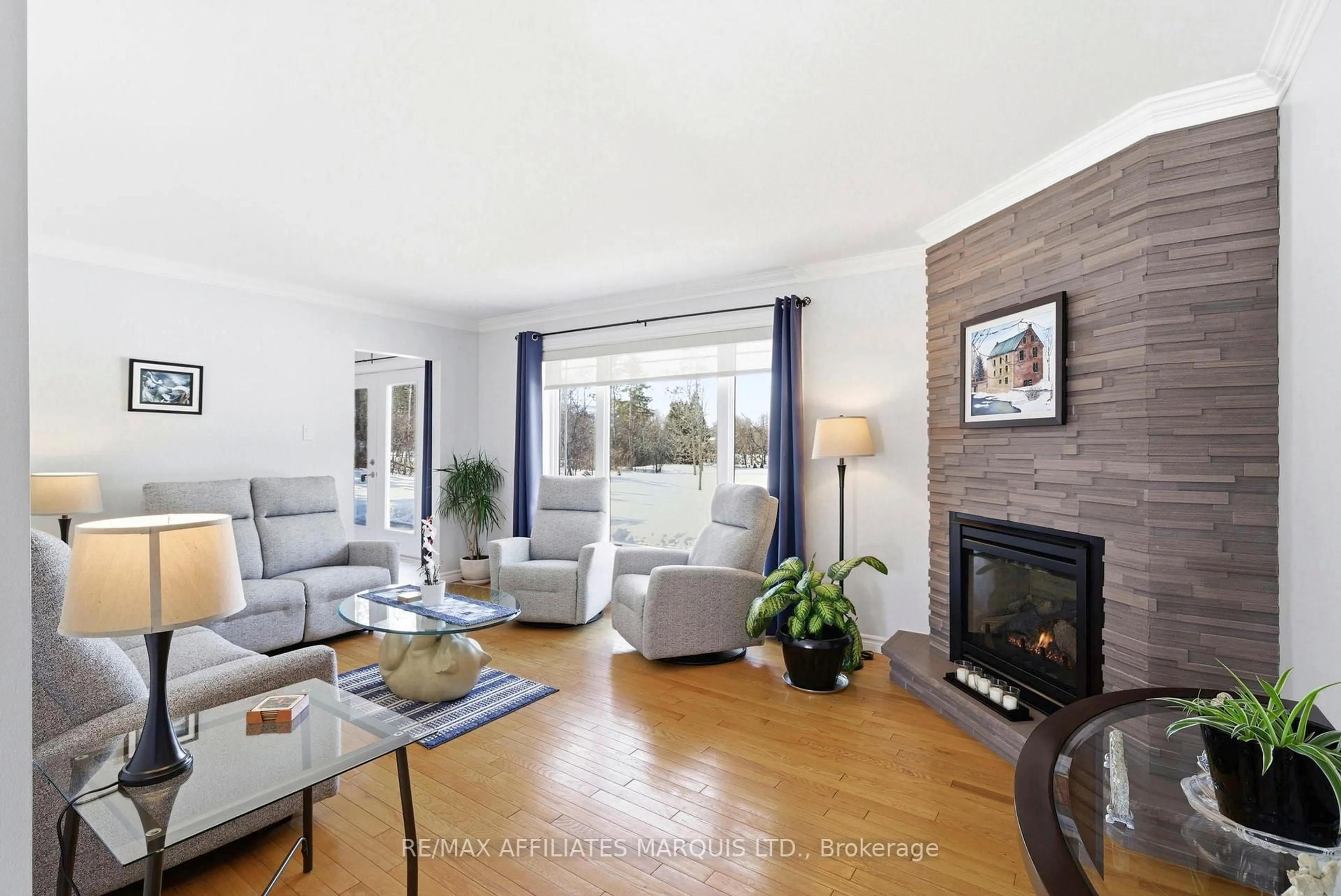 Living room with furniture, wood/laminate floor for 5650 Pinestone Dr, South Glengarry Ontario K0C 2J0