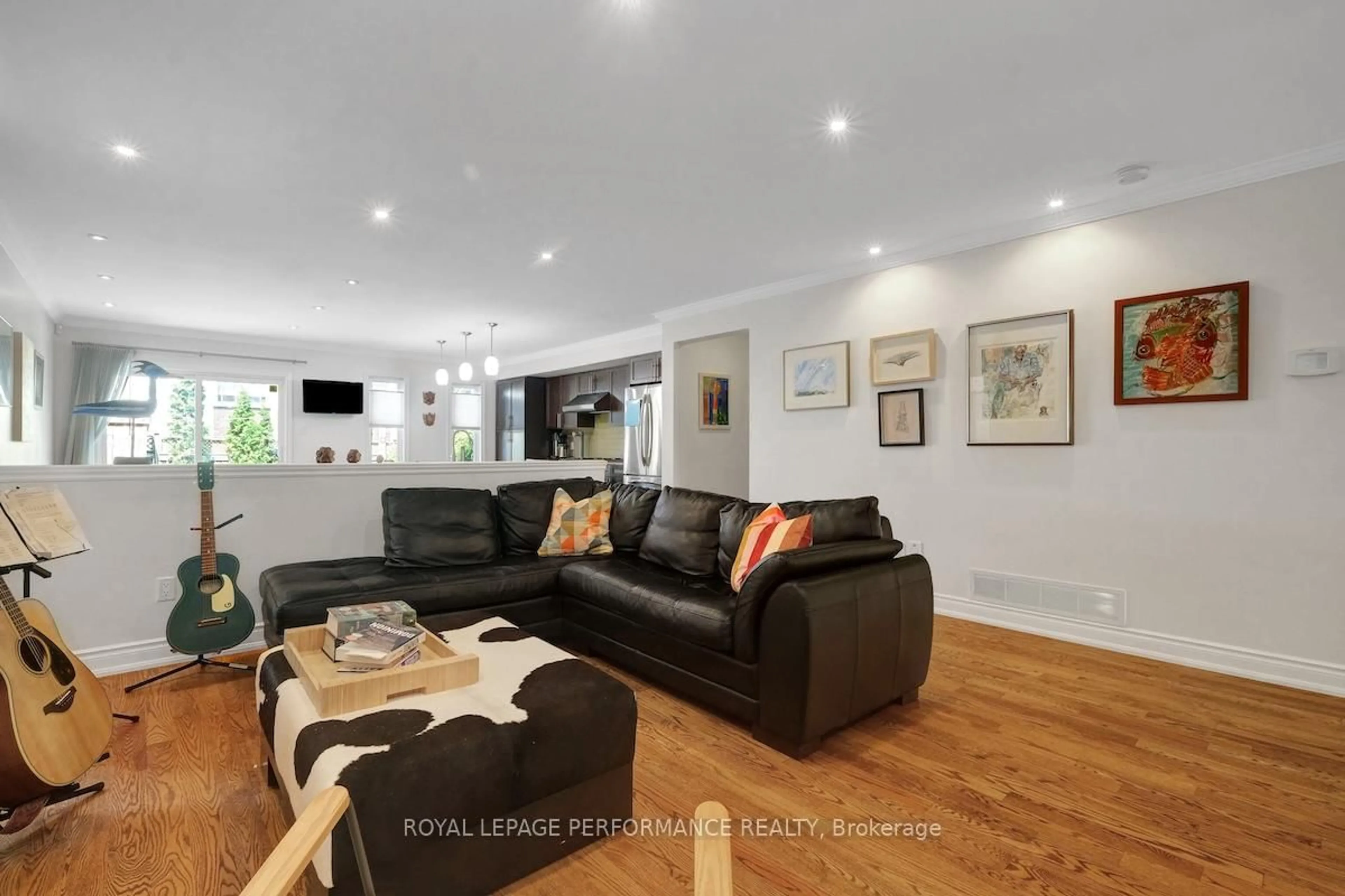 Living room with furniture, wood/laminate floor for 257 Currell Ave, Ottawa Ontario K1Z 7J5